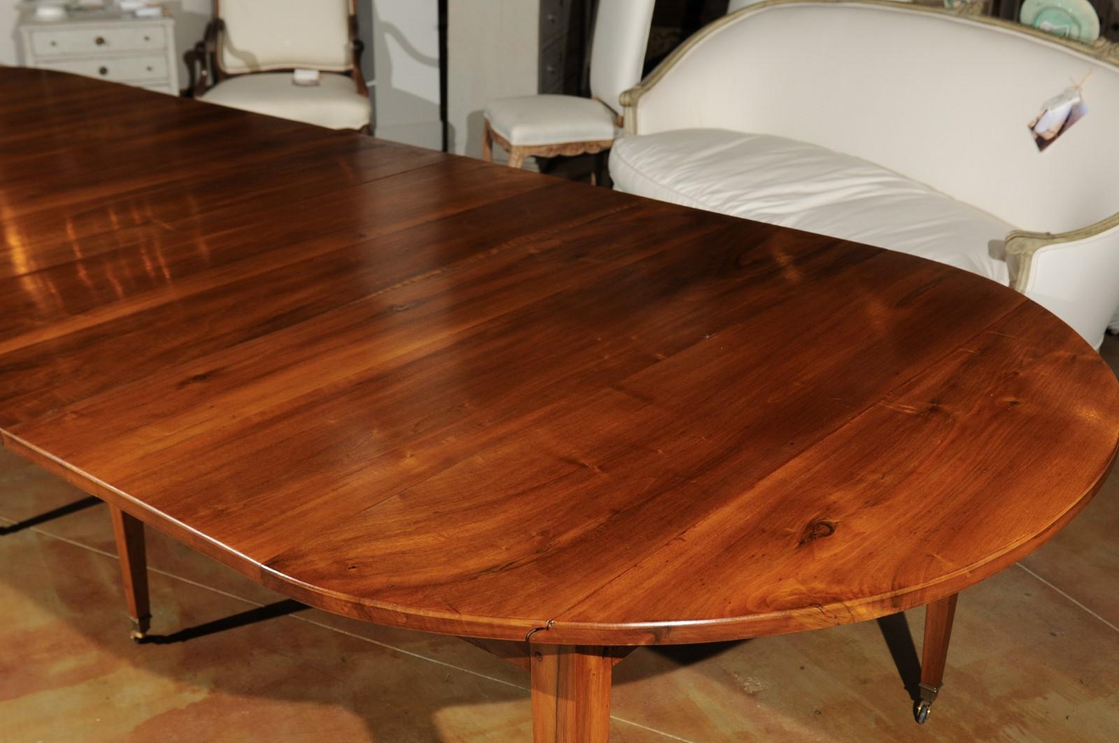 French 19th Century Oval Walnut Extension Dining Room Table with Brass Casters In Good Condition In Atlanta, GA