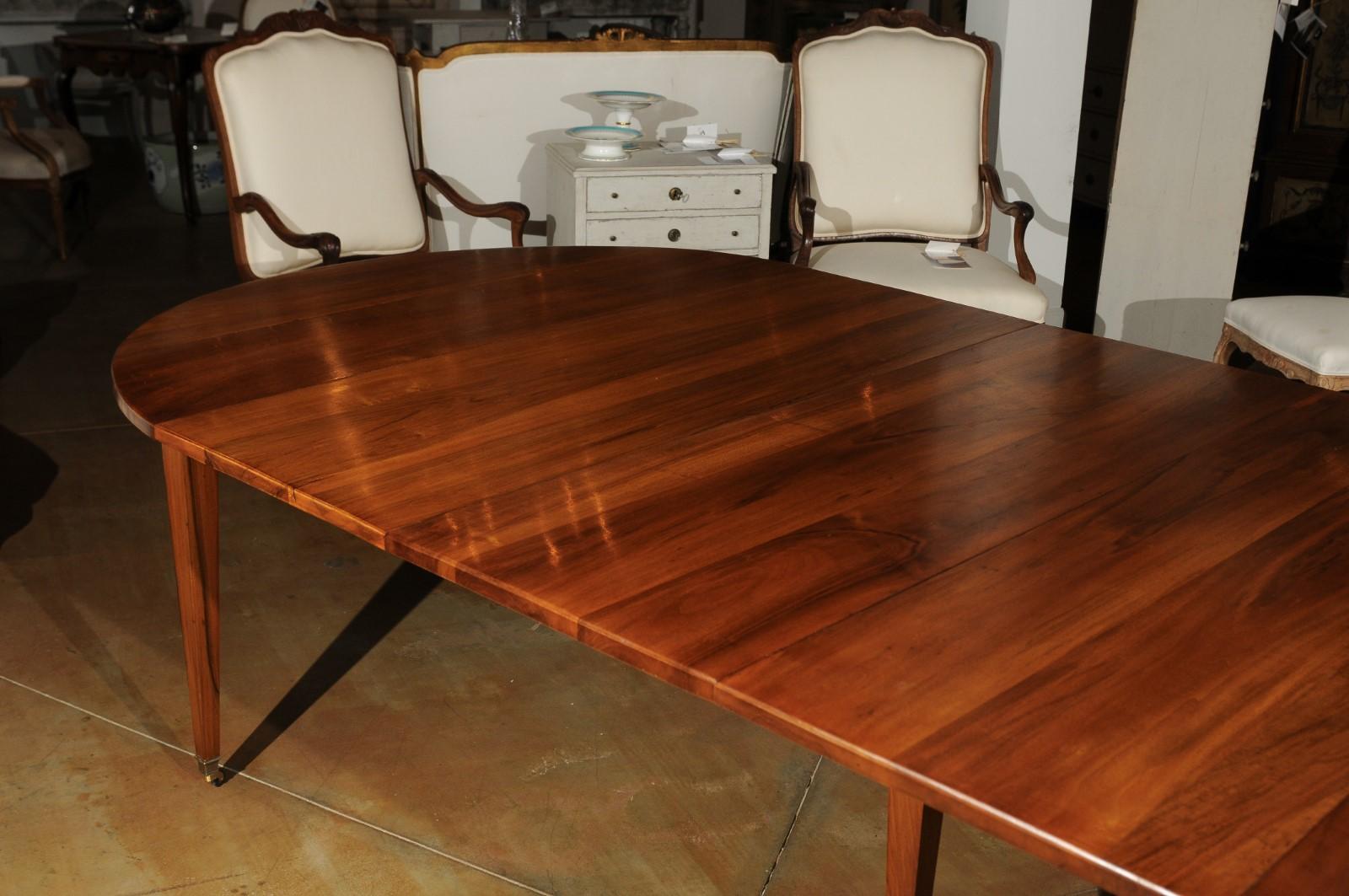 French 19th Century Oval Walnut Extension Dining Room Table with Brass Casters 1