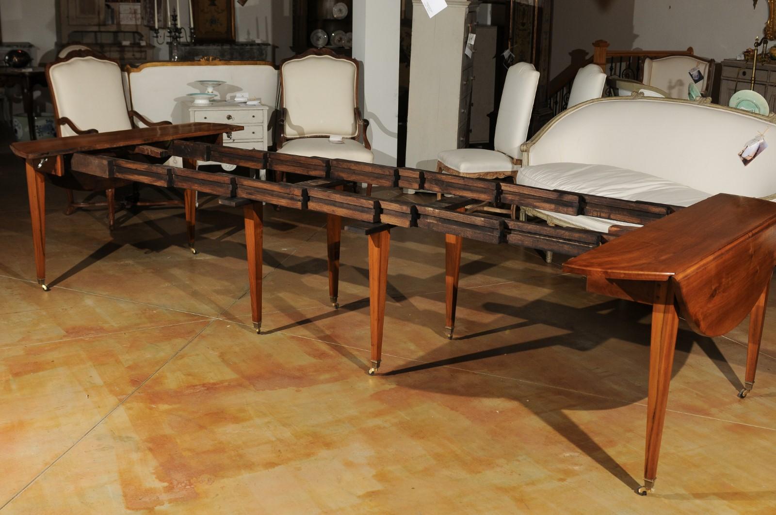 French 19th Century Oval Walnut Extension Dining Room Table with Brass Casters 3