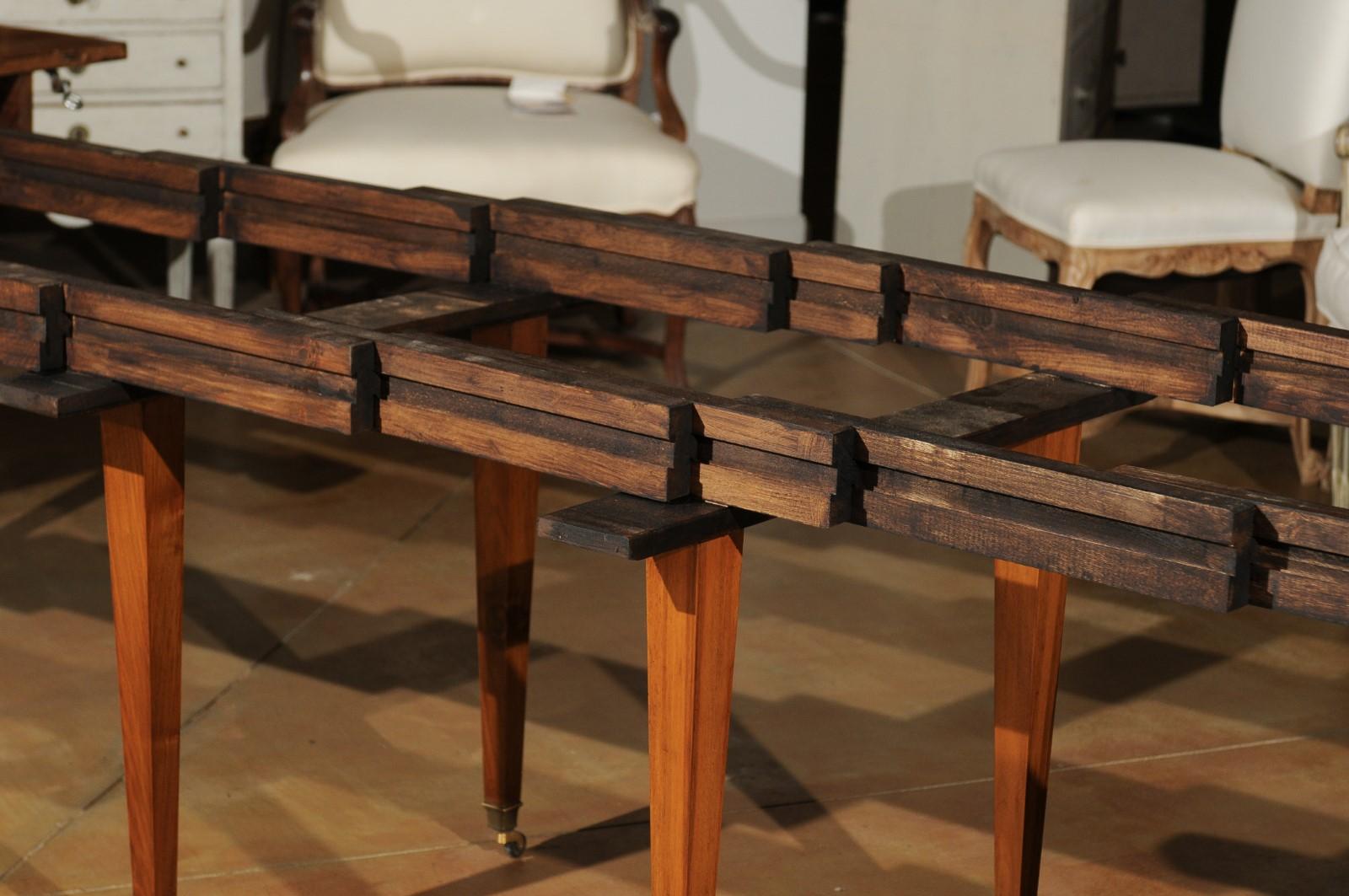 French 19th Century Oval Walnut Extension Dining Room Table with Brass Casters 4
