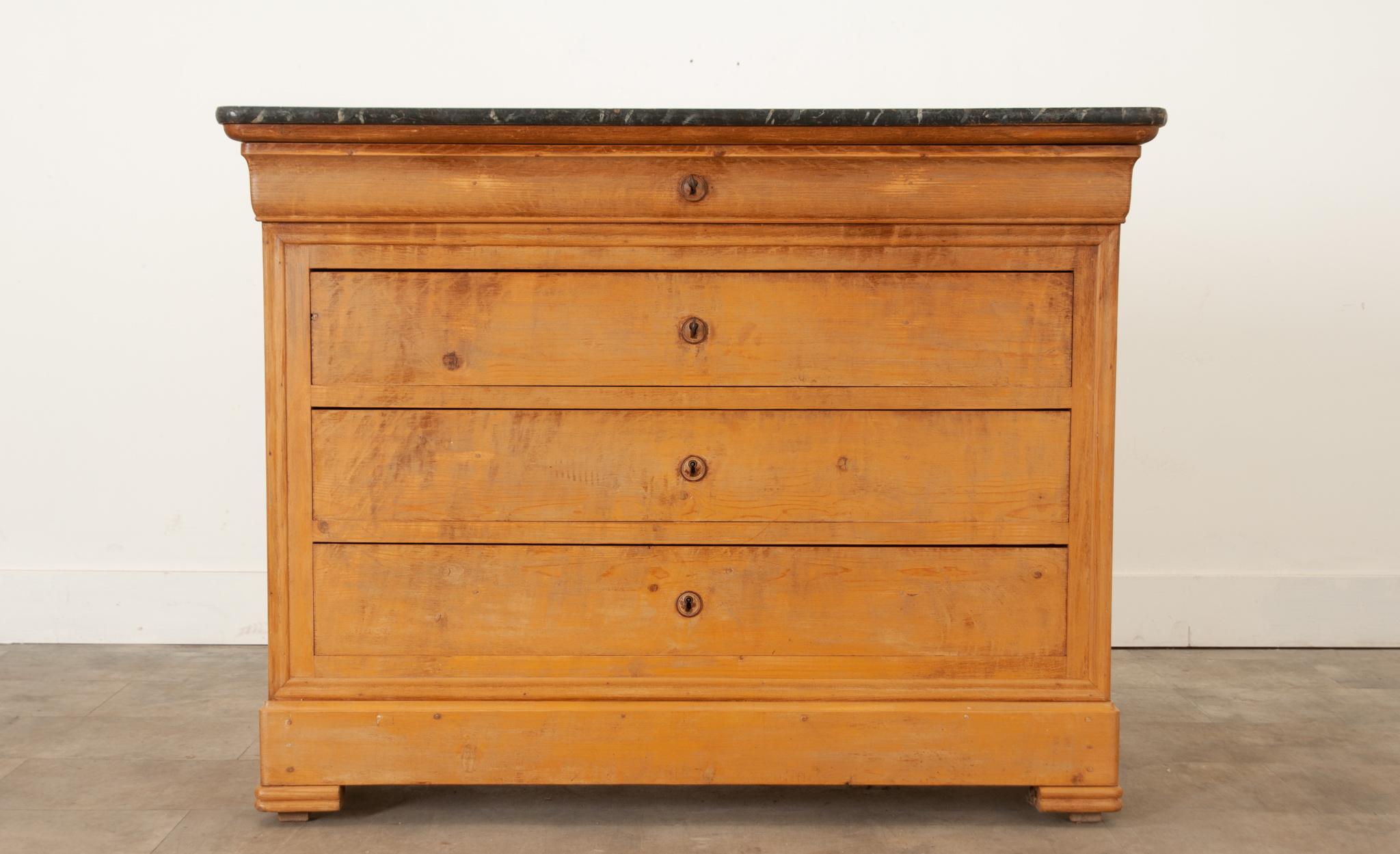 A French Louis-Phillipe painted commode circa 1850 with faux marble top and four drawers. Created in France during the 19th century, this lovely commode features a very interesting and unique rectangular faux marble top with rounded corners, sitting