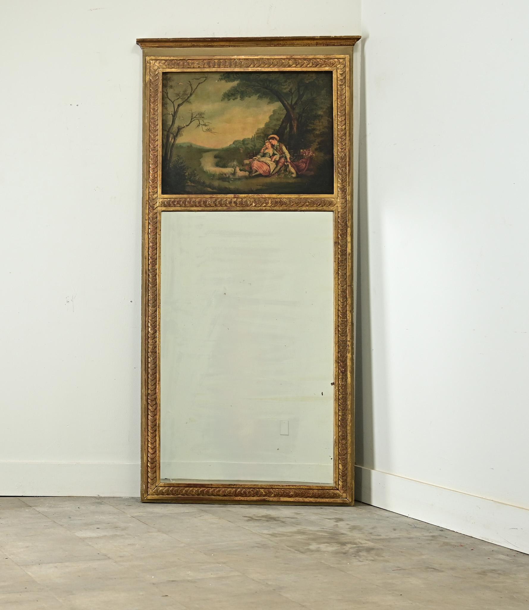 Questo specchio trumeau francese del XIX secolo combina l'architettura con l'arte, fondendo un olio su tela nel pannello superiore sopra la lastra rettangolare dello specchio sottostante. Incastonato in una cornice dipinta in verde Sage e rifinita