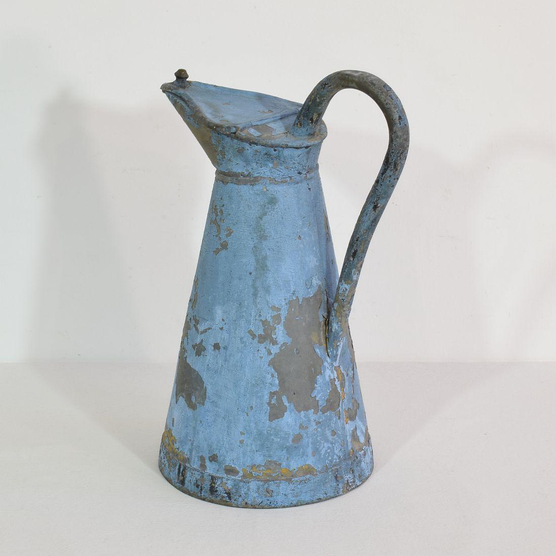Stunning zinc ewer or water jug with stunning old blue paint. 
France, circa 1880-1900. Weathered.