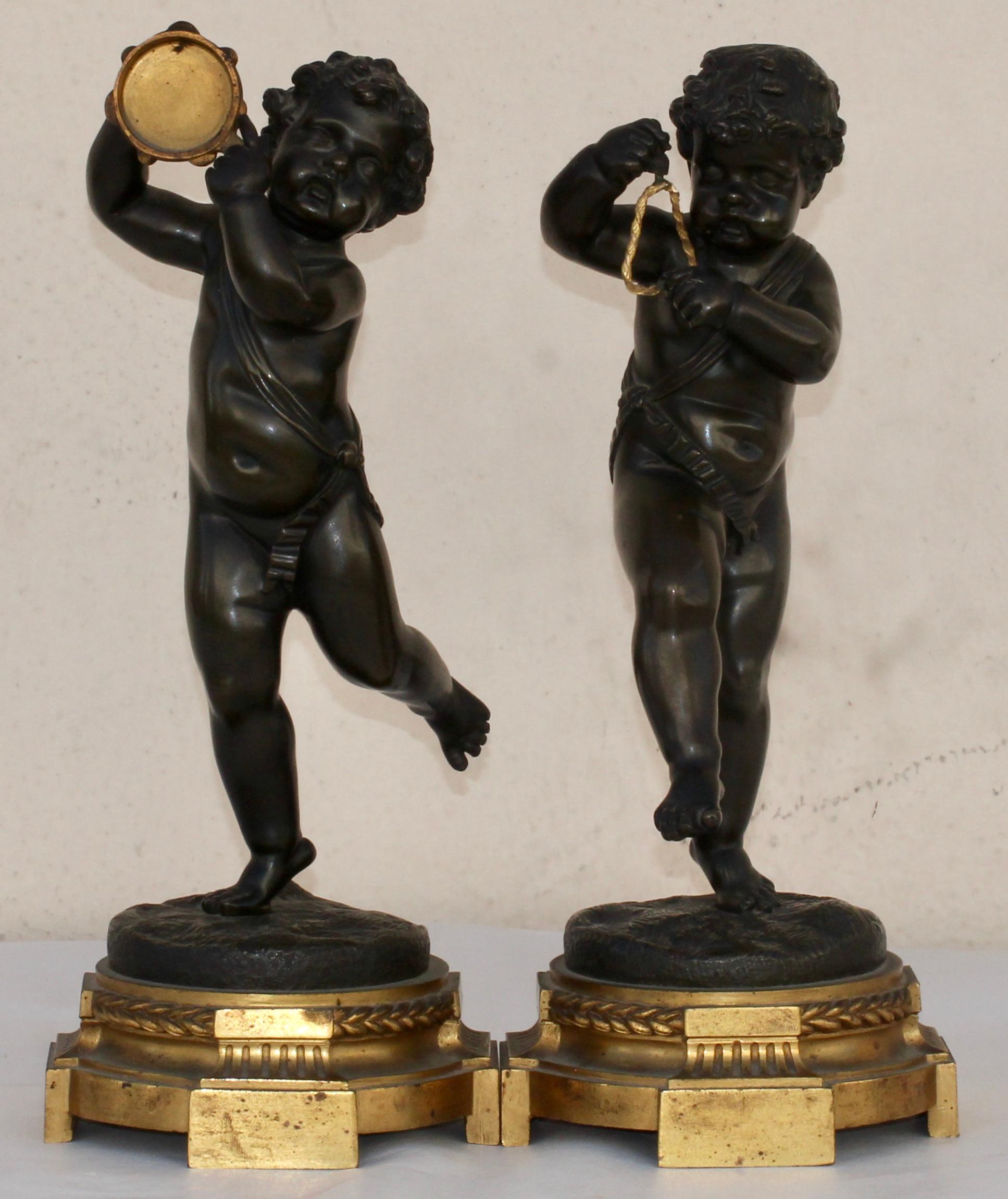 A French 19th century pair of bronze musicians Putti
Patinated bronze on ormolu base
Louis XVI style
circa 1880.