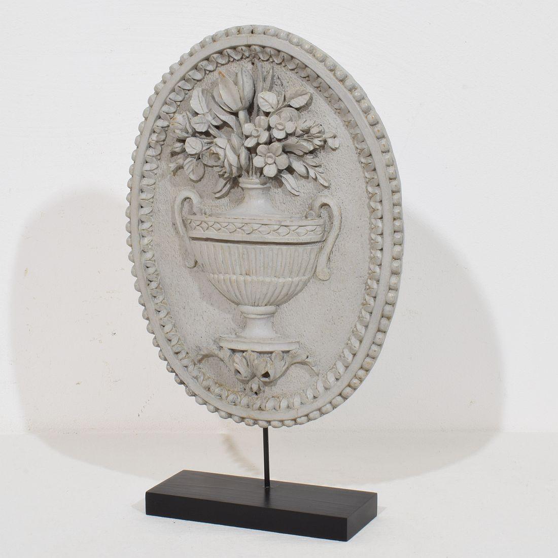 Wonderful wooden panel depicting a vase with flowers in Louis XVI style with beautiful old color.
France circa 1850. Weathered.
Measurements include the wooden base..
H:35,5cm  W:21cm D:6,5cm 