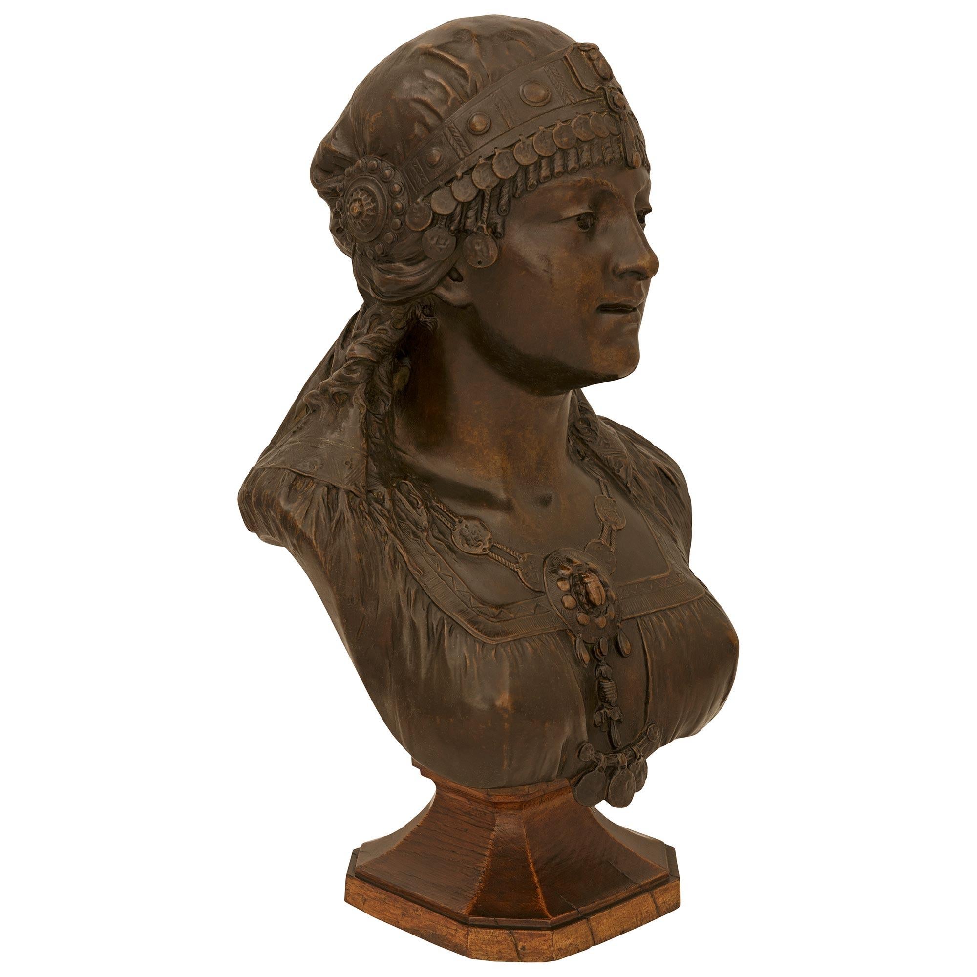 Patinated French 19th century patinated Bronze and Oak bust signed Cesar Ceribelli, Paris For Sale
