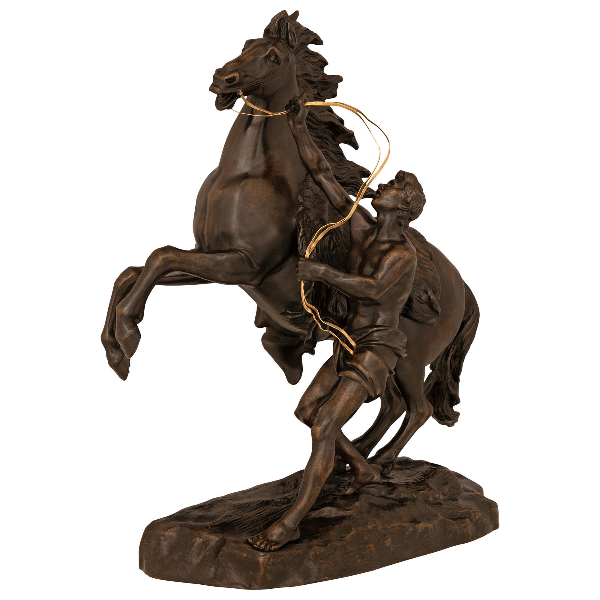 French 19th Century Patinated Bronze And Ormolu Statue Of A Horse And Groom In Good Condition For Sale In West Palm Beach, FL