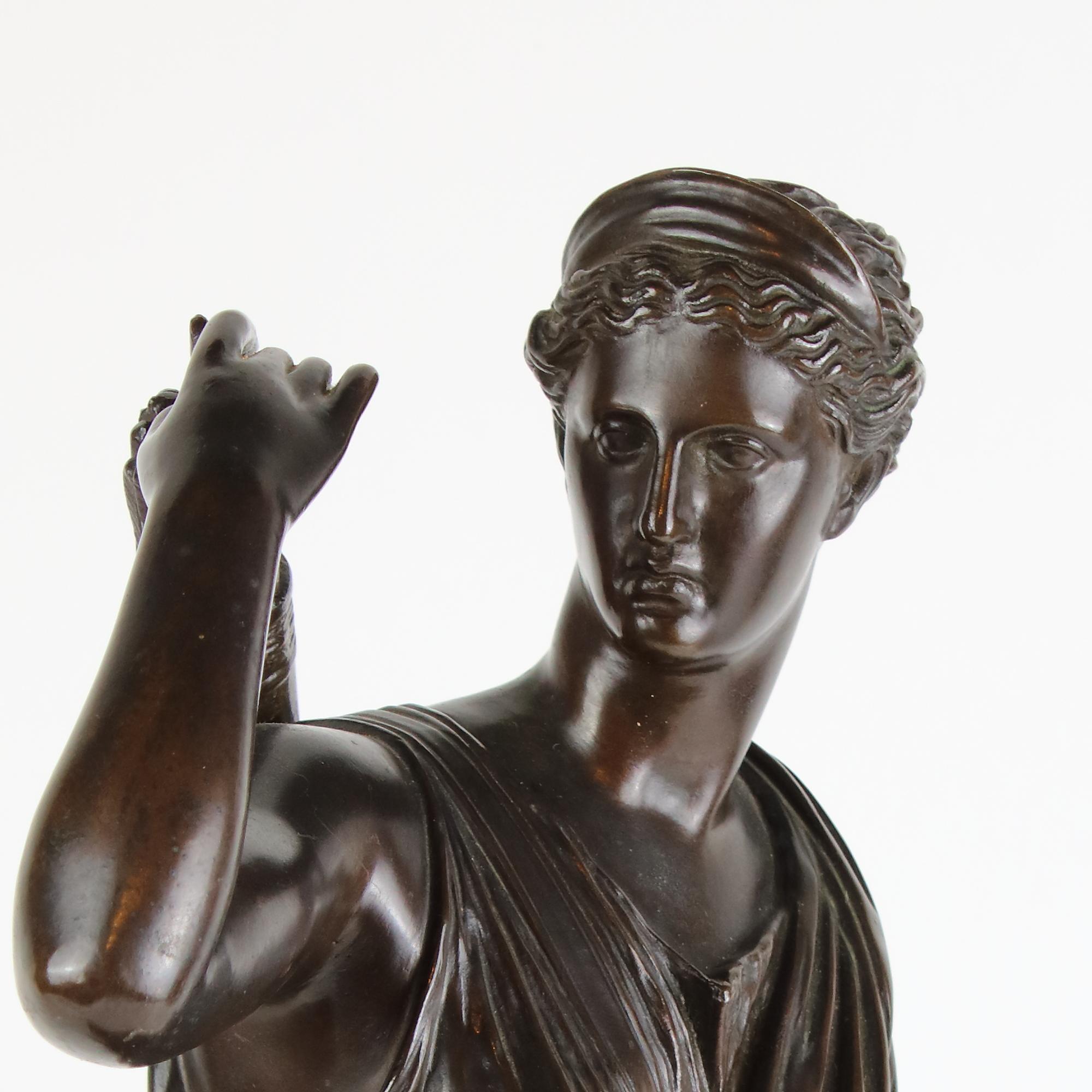 French 19th Century Patinated Bronze Sculpture Copy of Roman Diana of Versailles

Patinated bronze sculpture of youthful Diana, goddess of the Hunt on a rectangular plinth clad in a short peplum and caught in the moment of running; her right arm