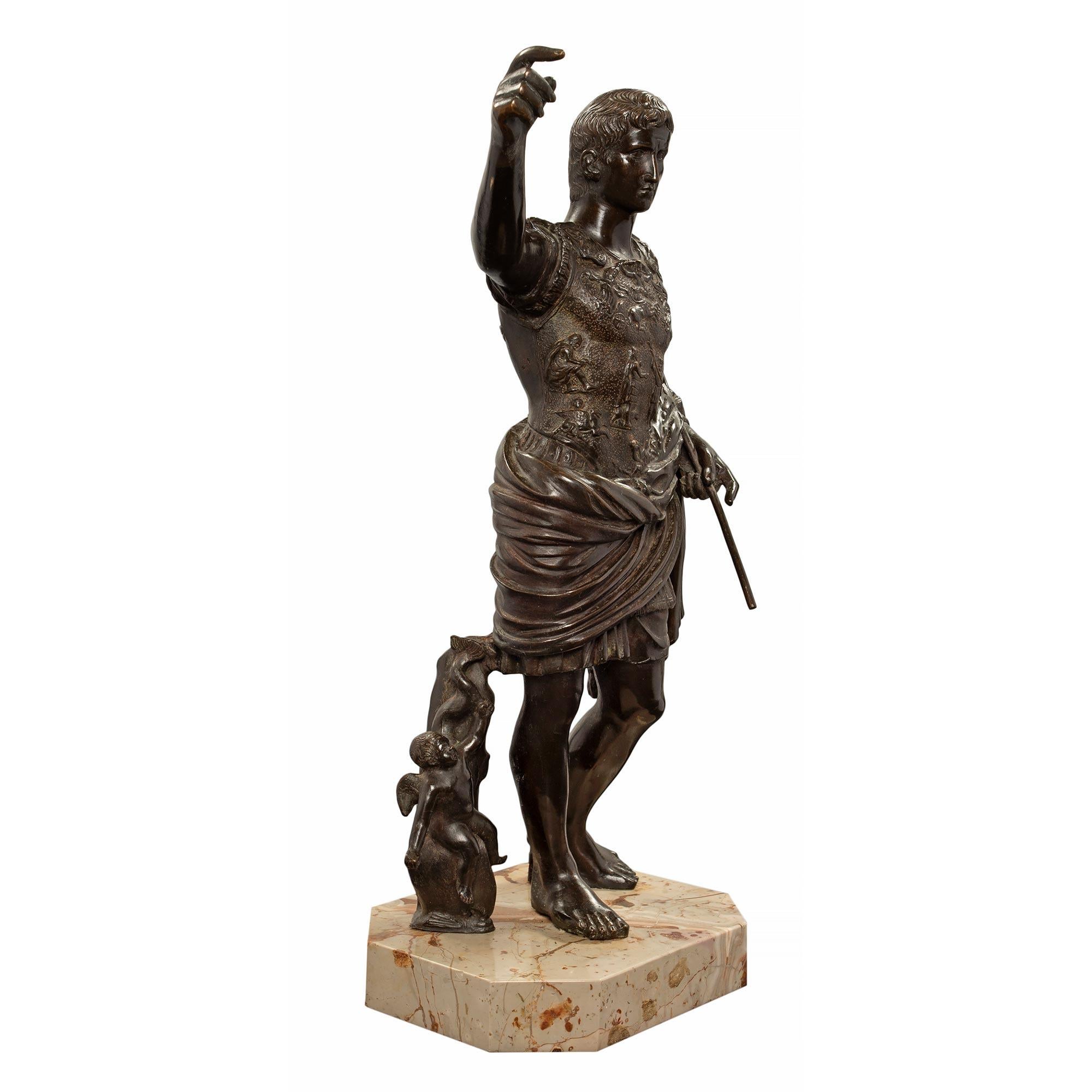 A handsome French 19th century patinated bronze statue of Augustus of Prima Porta. The statue is raised by a square marble base with cut corners. Augustus of Prima Porta was also known as Julius Caesar. A Roman statesman and military leader, he