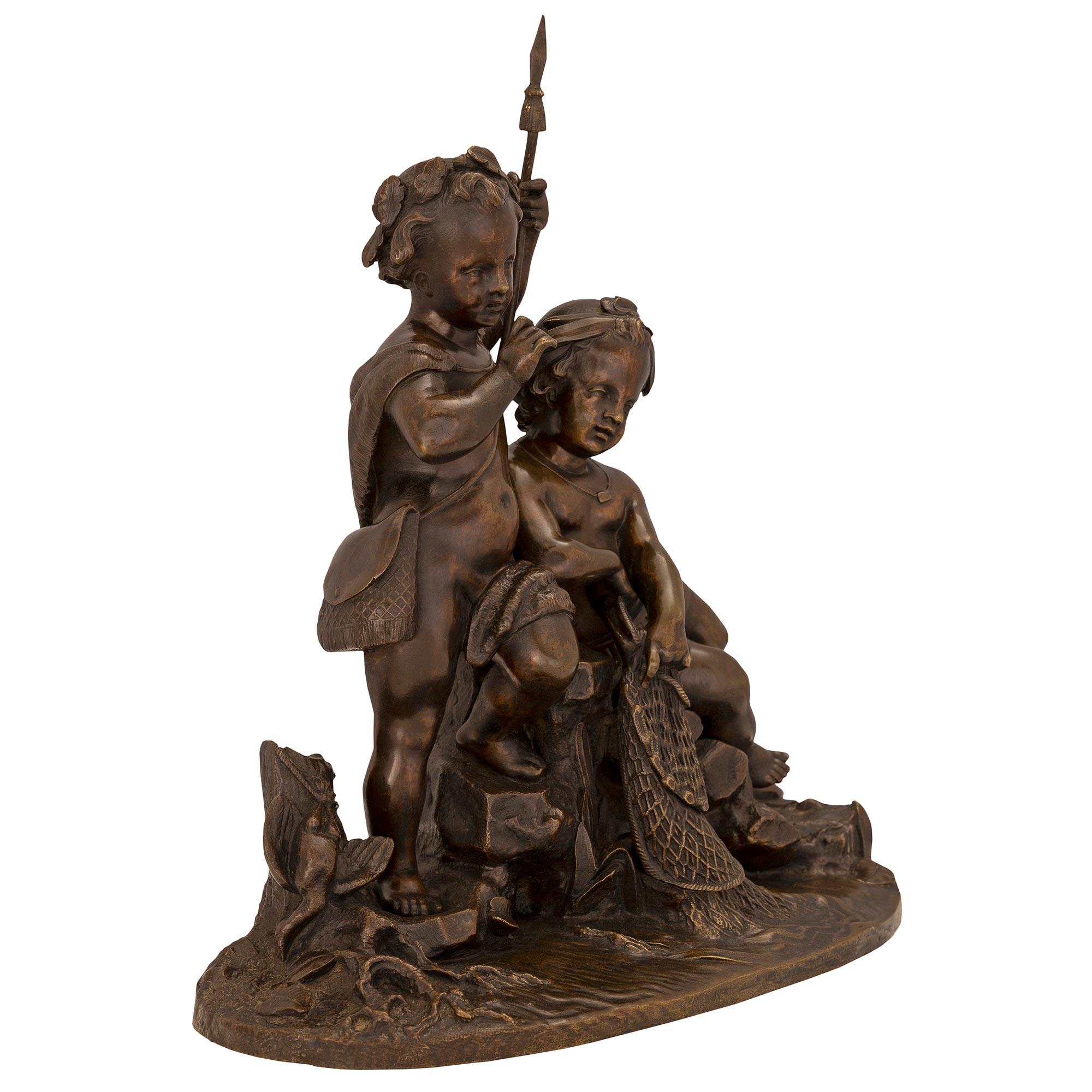 A charming and high quality French 19th century patinated bronze statue of two young boys fishing. The statue is raised by an oblong base with a fine ground like design with water flora growing next to impressive rocks and a tree trunk. One young