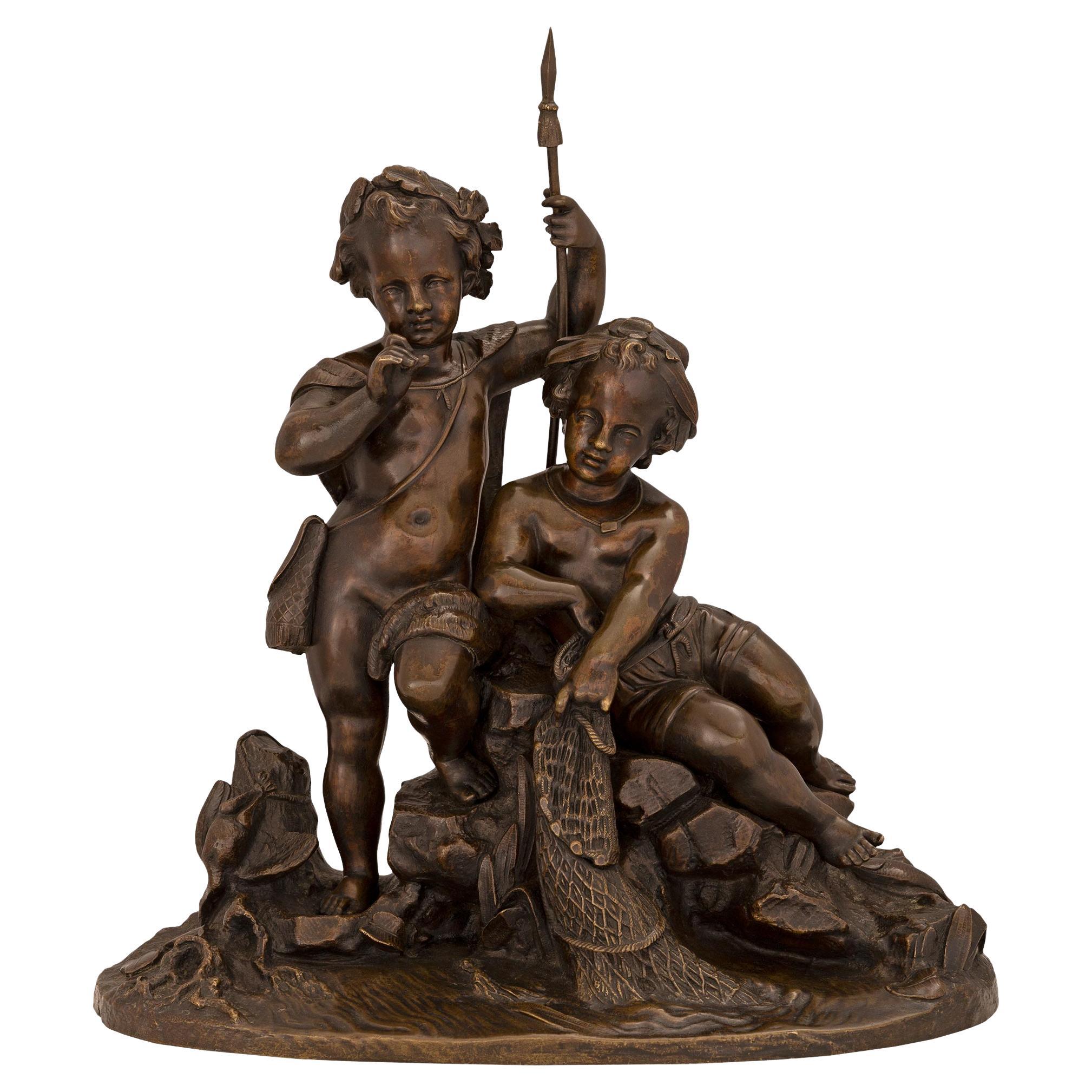 Statue française du 19ème siècle en bronze patiné représentant deux jeunes garçons pêchent en vente