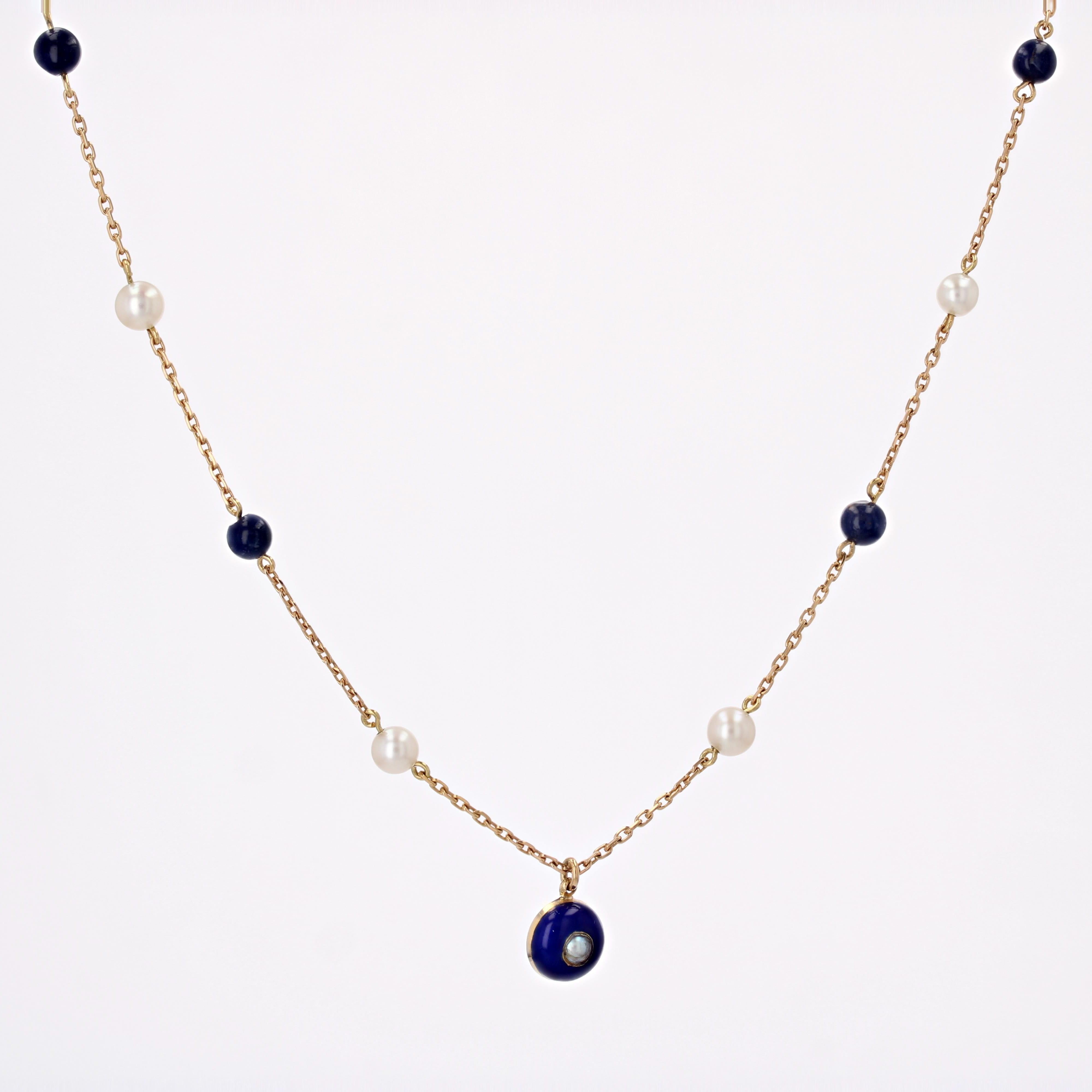 Creation Baume - Unique piece.

Necklace in 18 carat yellow gold, eagle head hallmark. 

It is decorated on the front with 4 beads of lapiz lazuli and 4 cultured pearls of alternate. The central motif is a half-sphere in blue enamel set with a fine