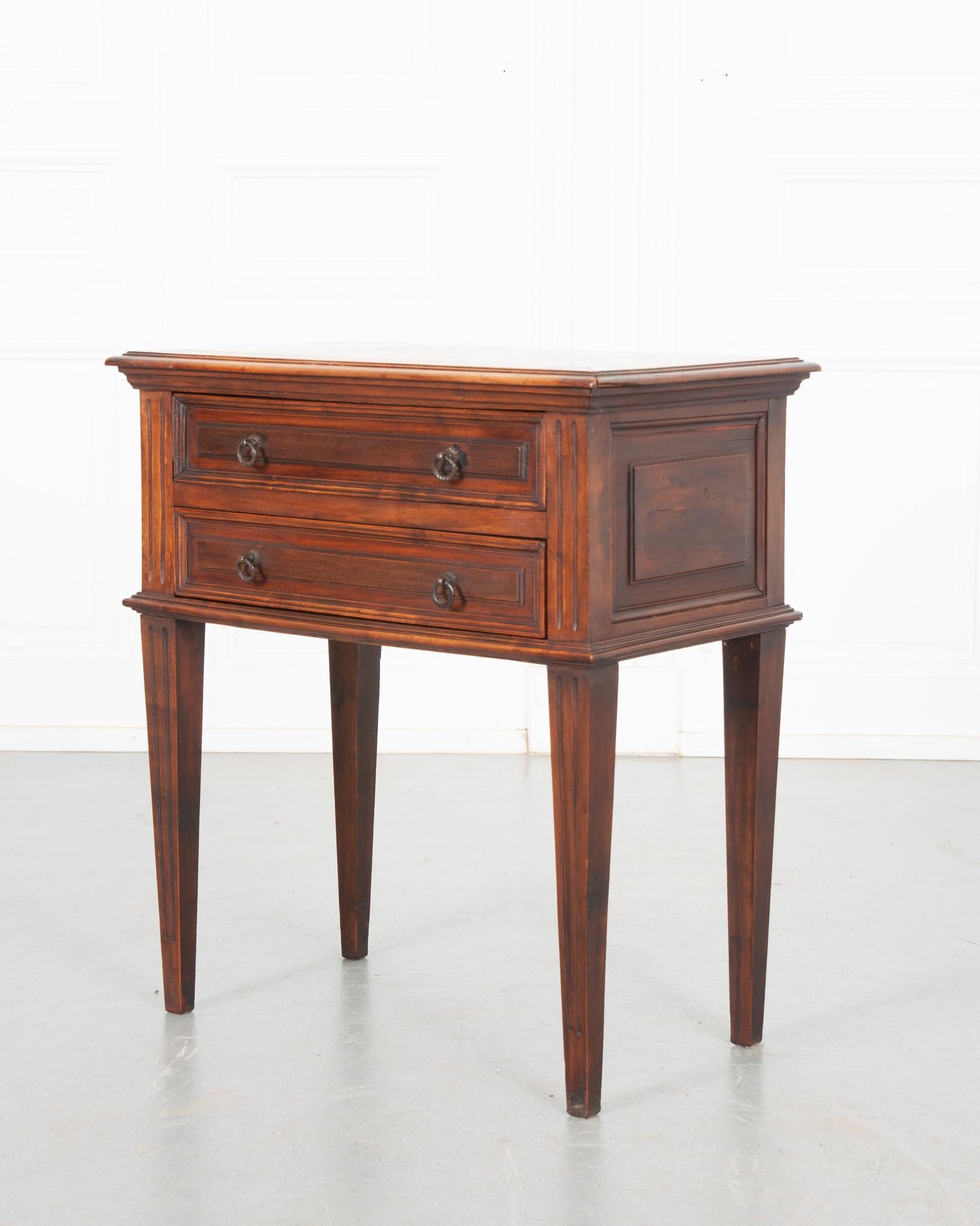 This unique side table was crafted in France, circa 1870. Both drawers feature thumbnail carving and a pair of small metal drop ring pulls. A pre-sectioned drawer and inserts provide a great amount of organization for small keepsakes. Fluting