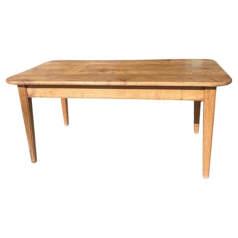 This is a fine example of a smaller example of a 19th Century French farm table. It is made of pinewood and has one large end drawer. 