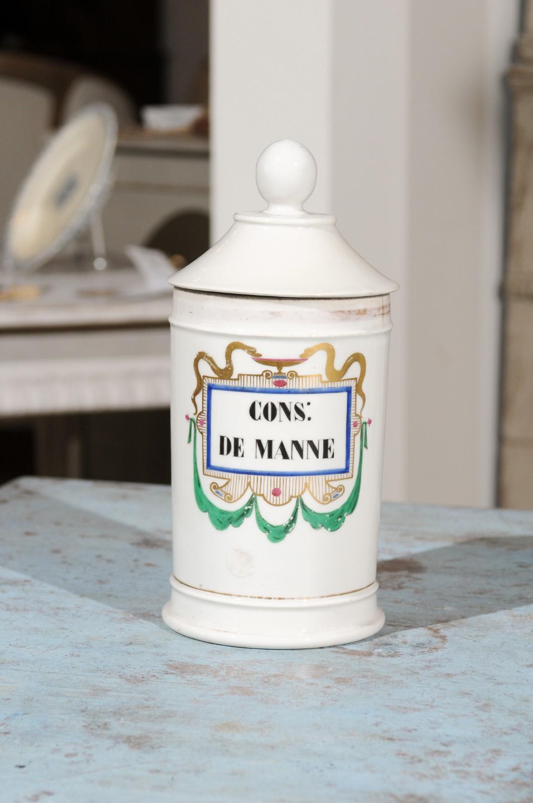 A French porcelain pharmacy lidded jar from the 19th century, with front label and Bowl of Hygieia motif. Born in France during the politically dynamic 19th century, this handsome apothecary jar features a conic lid with round finial, sitting above