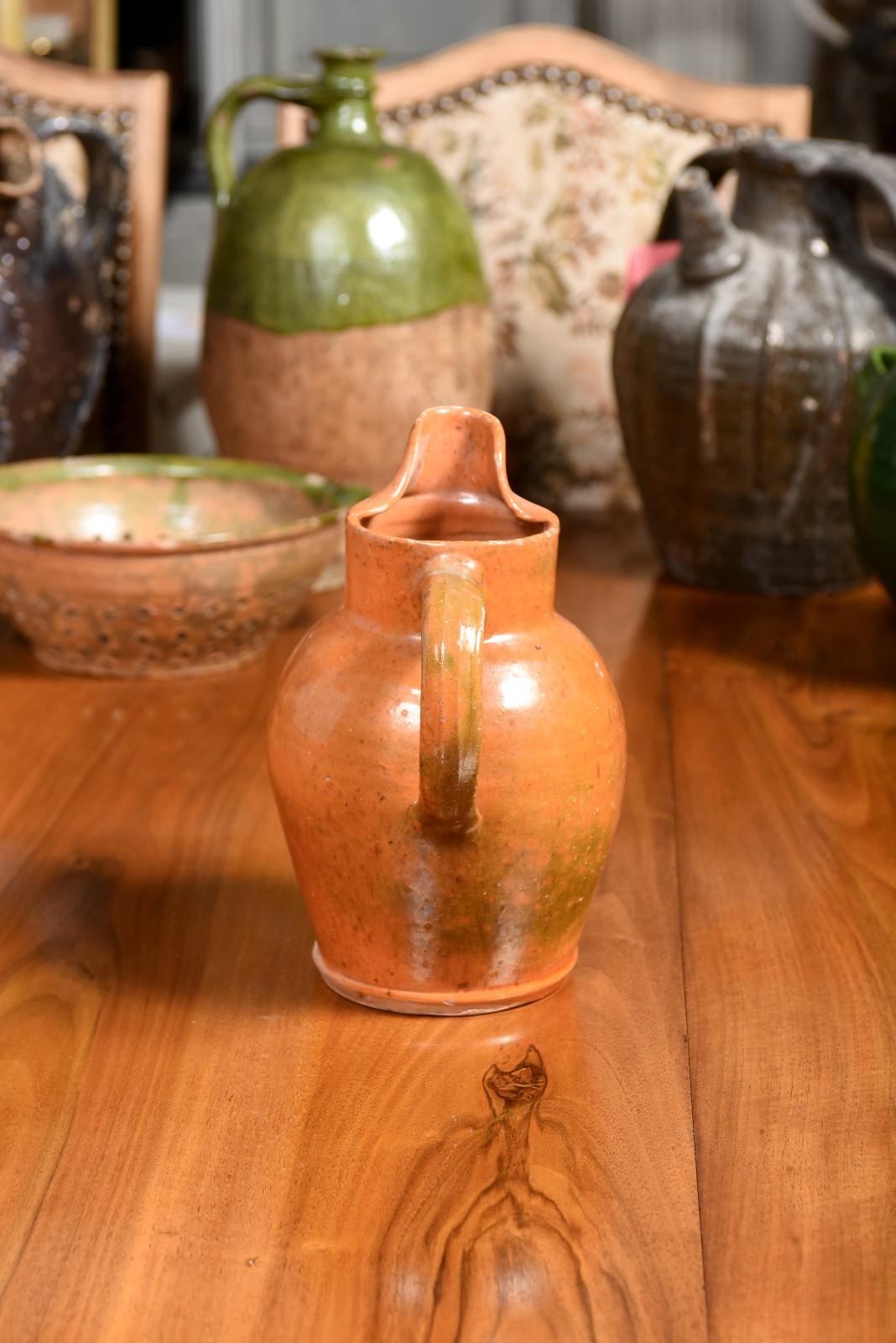 French 19th Century Pottery Jug with Orange Glaze, Back Handle and Front Spout 2