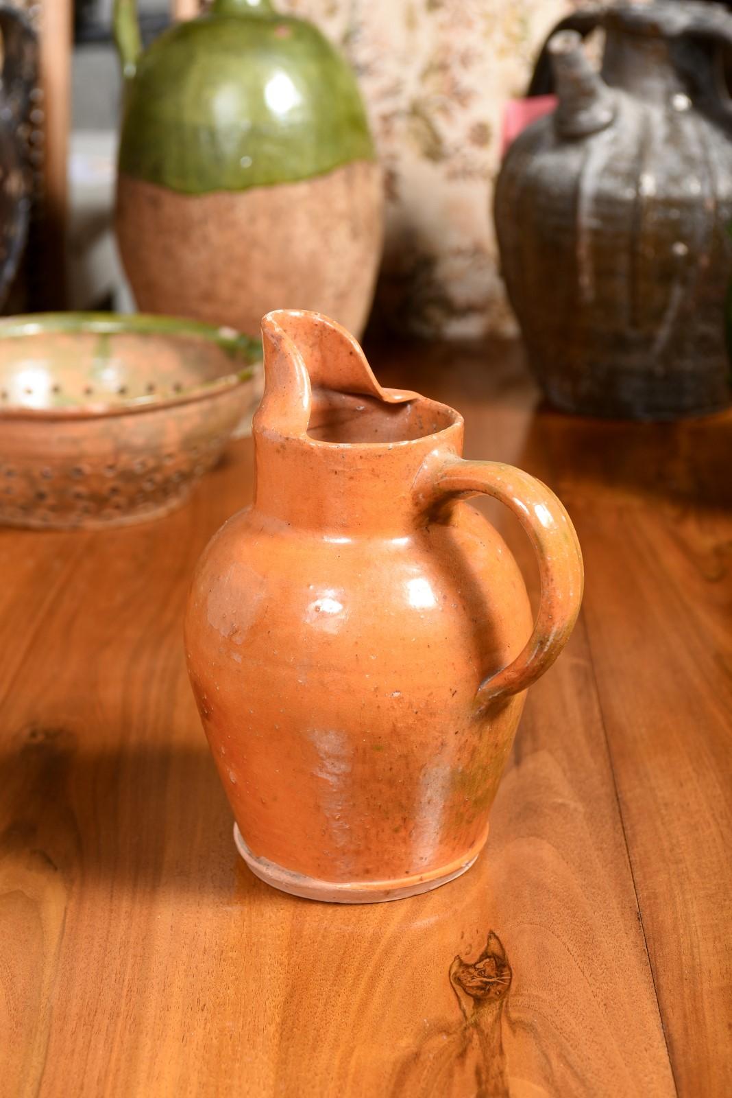 French 19th Century Pottery Jug with Orange Glaze, Back Handle and Front Spout 4