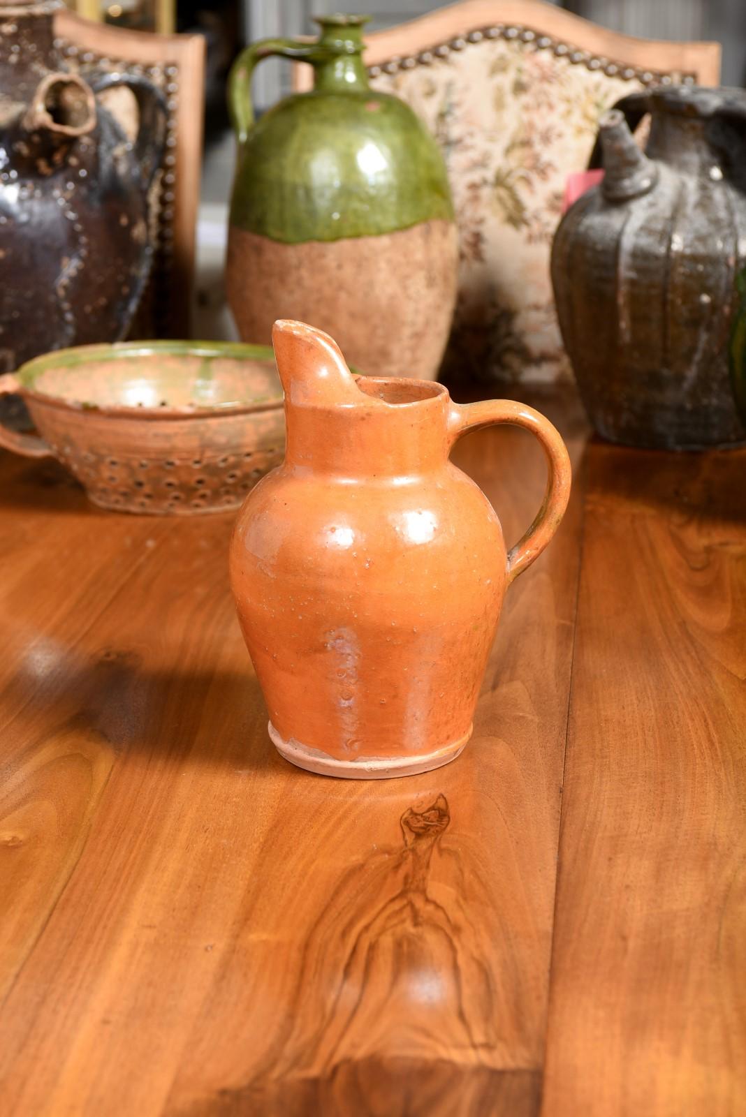 French 19th Century Pottery Jug with Orange Glaze, Back Handle and Front Spout 5