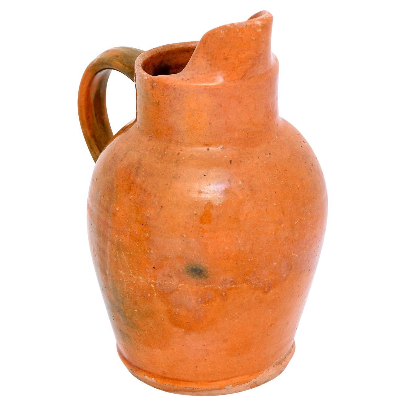 French 19th Century Pottery Jug with Orange Glaze, Back Handle and Front Spout