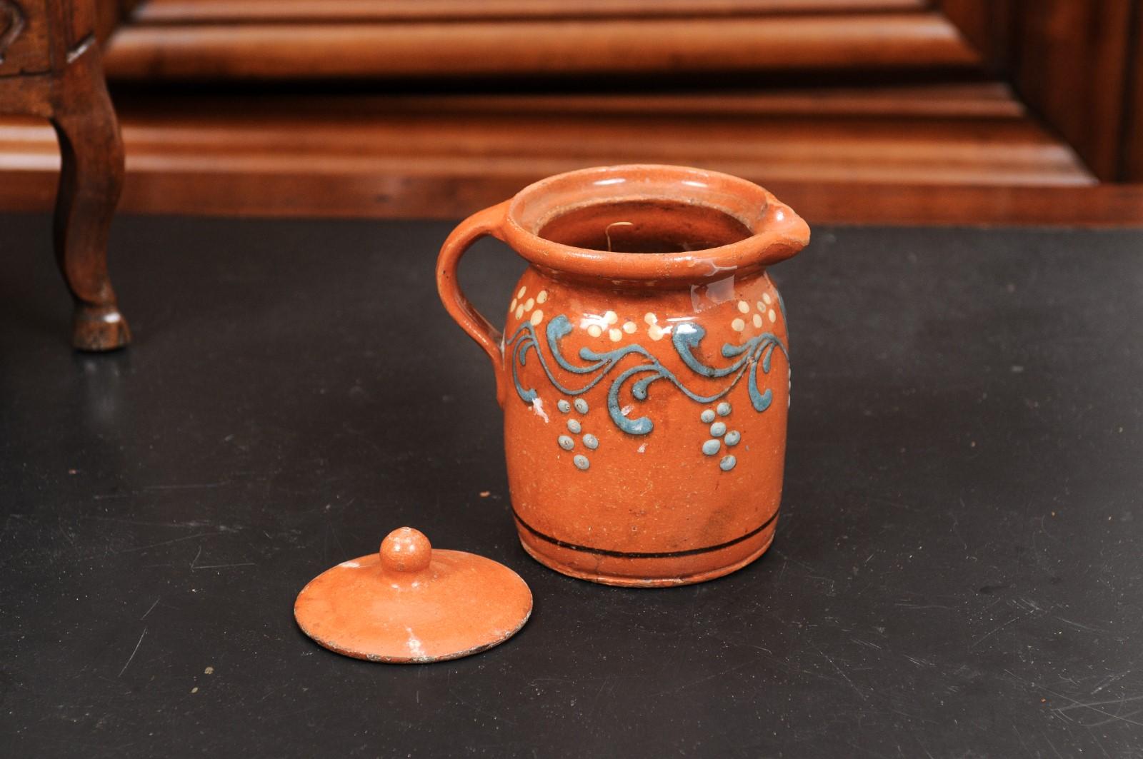 French 19th Century Pottery Pitcher with Orange and Blue Glaze and Foliage Motif For Sale 6