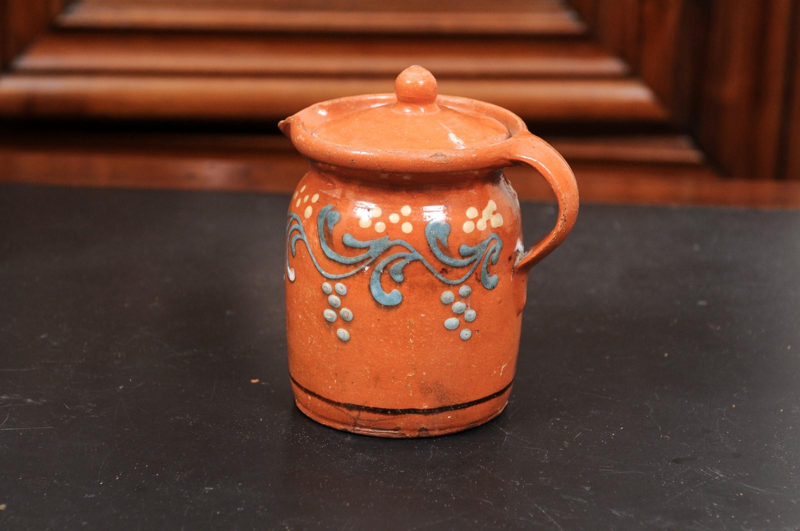 French 19th Century Pottery Pitcher with Orange and Blue Glaze and Foliage Motif For Sale 2