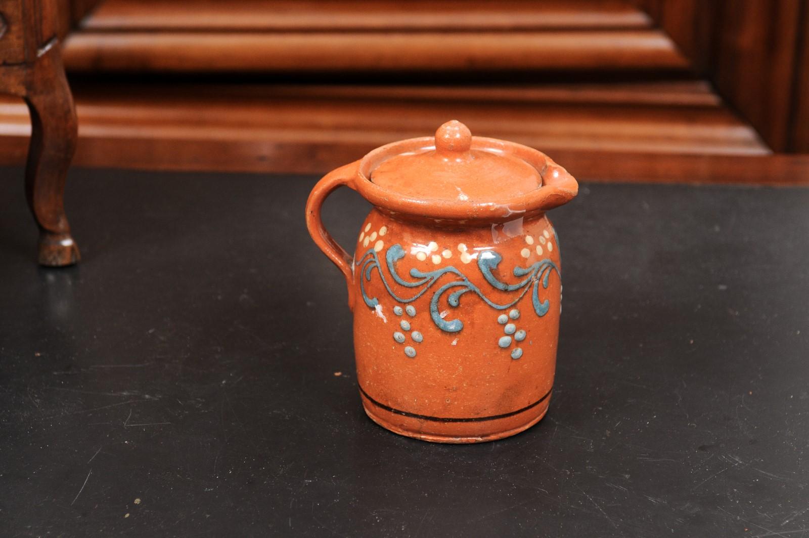 French 19th Century Pottery Pitcher with Orange and Blue Glaze and Foliage Motif For Sale 5