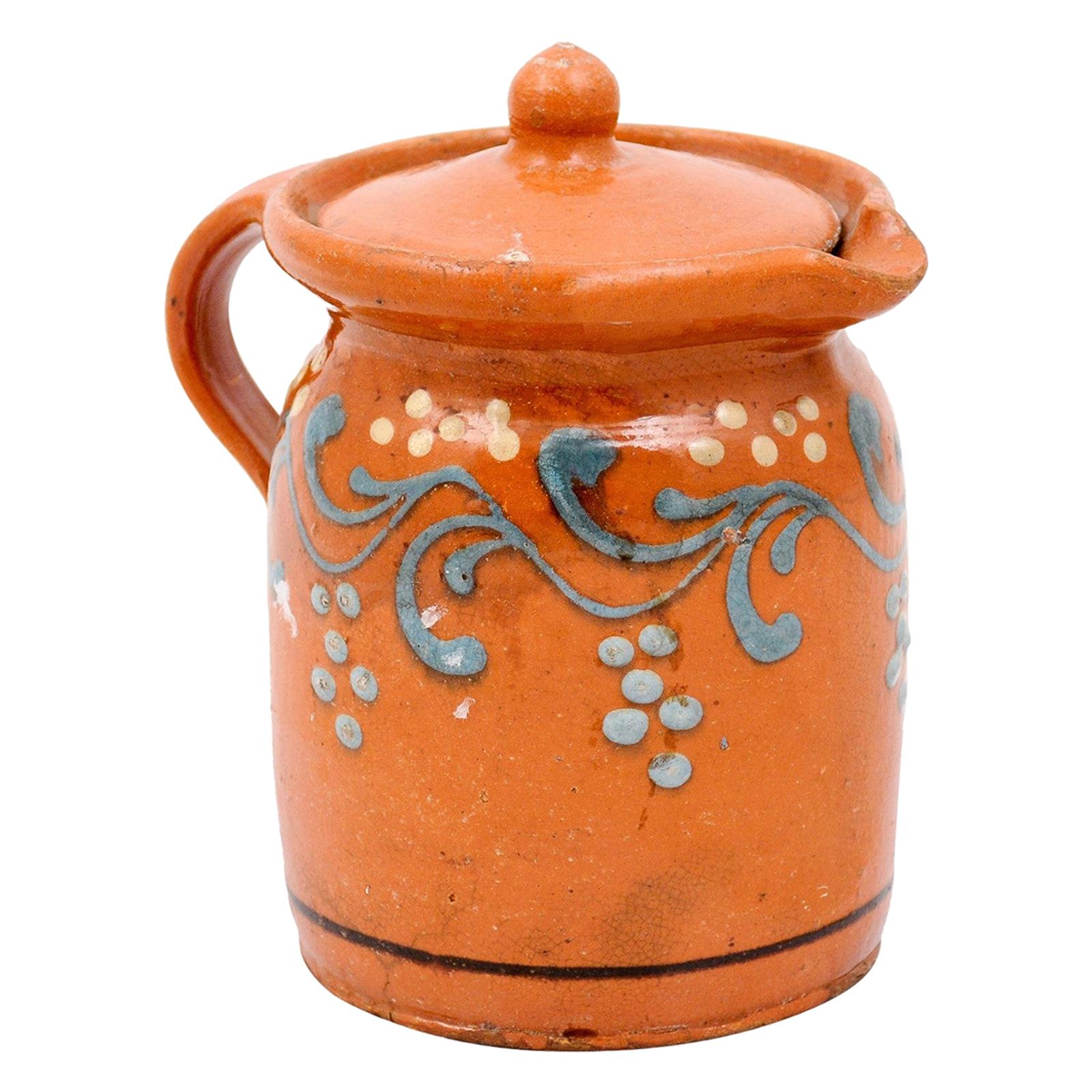 Keramikkrug aus dem 19. Jahrhundert mit orangefarbener und blauer Glasur und Blattmotiv