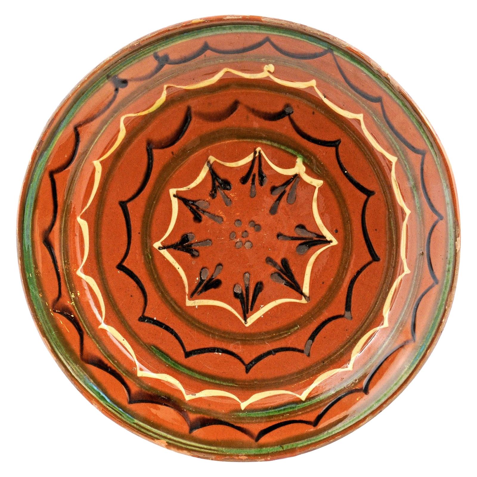 French 19th Century Pottery Plate with Rust Glaze, Black, Green and Cream Motifs