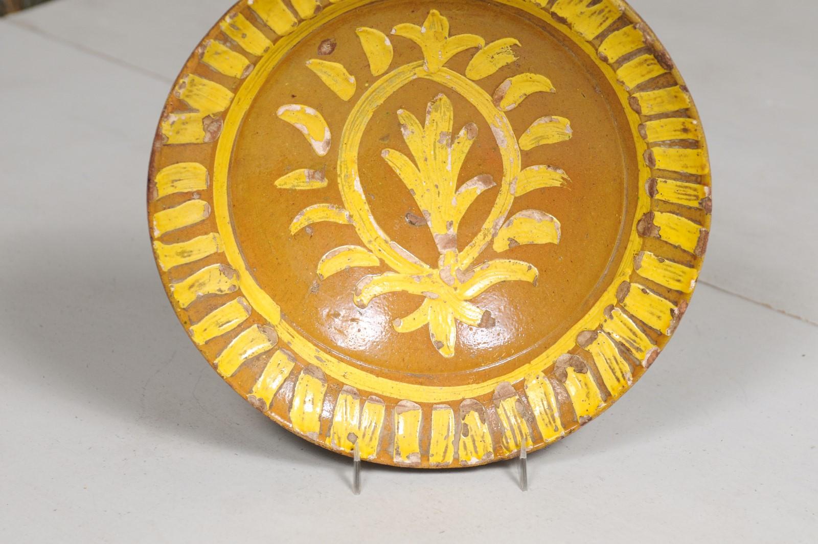 Glazed French 19th Century Pottery Soup Plate with Yellow Starburst Pattern and Foliage