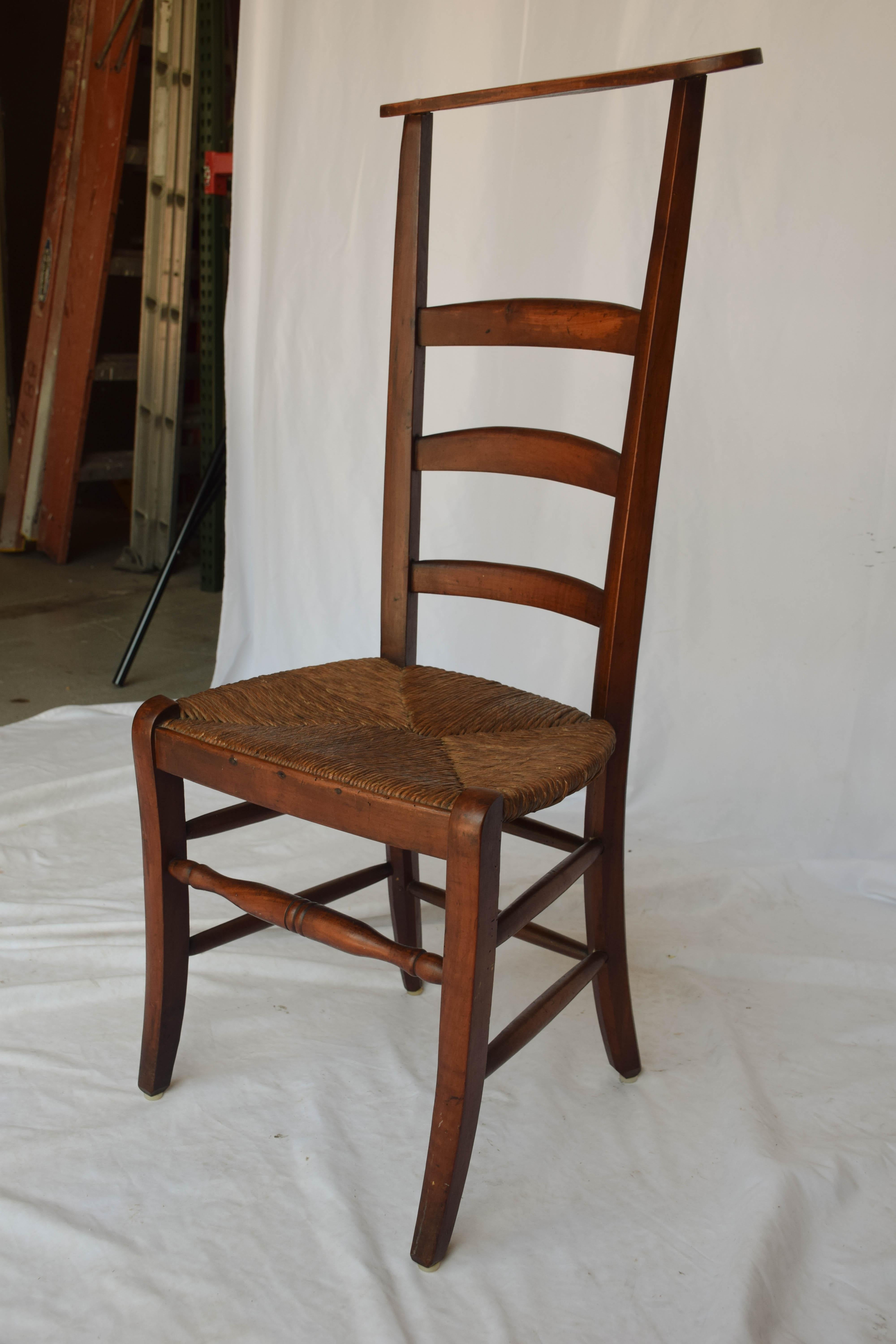 19th century Prie-Dieu, prayer chair from France, handcrafted with a rush seat. This charming prie dieu was once used in a French church as both chair and kneeler. This piece will surely add provincial charm to your home. Though not as noble as its