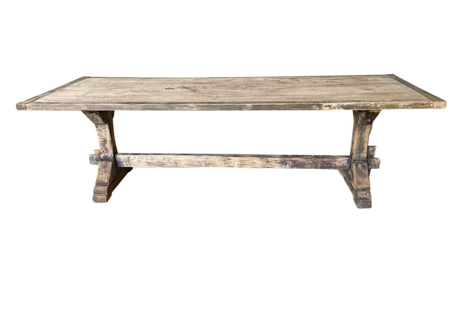 French 19th Century Primitive Farm Table - Trestle Table from the South of France.  Soundly constructed from painted and washed beech.  A charming table that will add warmth to its environment.