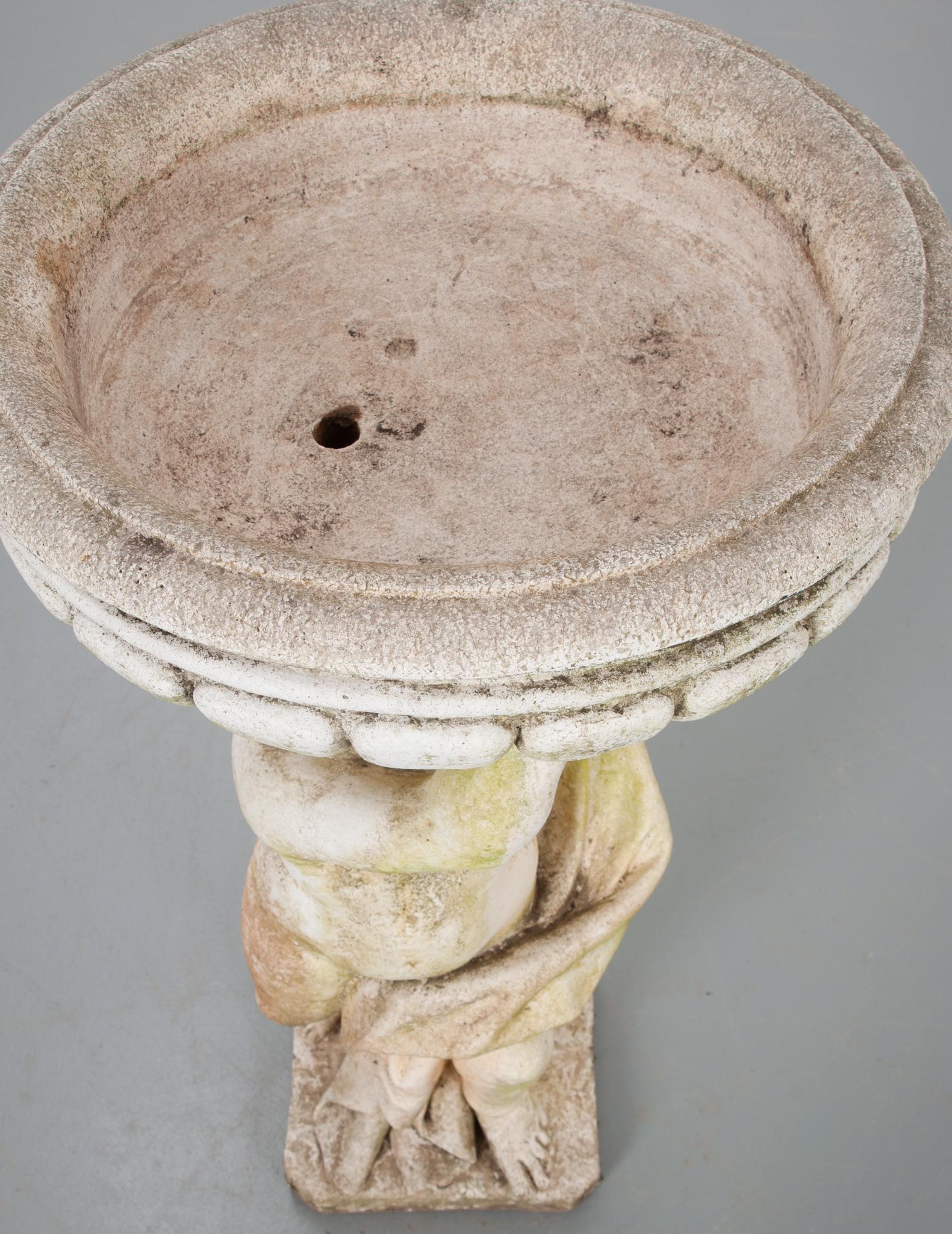 This French 19th century putti figured bird bath can also be a fountain. It has a beautiful weathered patina and is ready for your garden.
