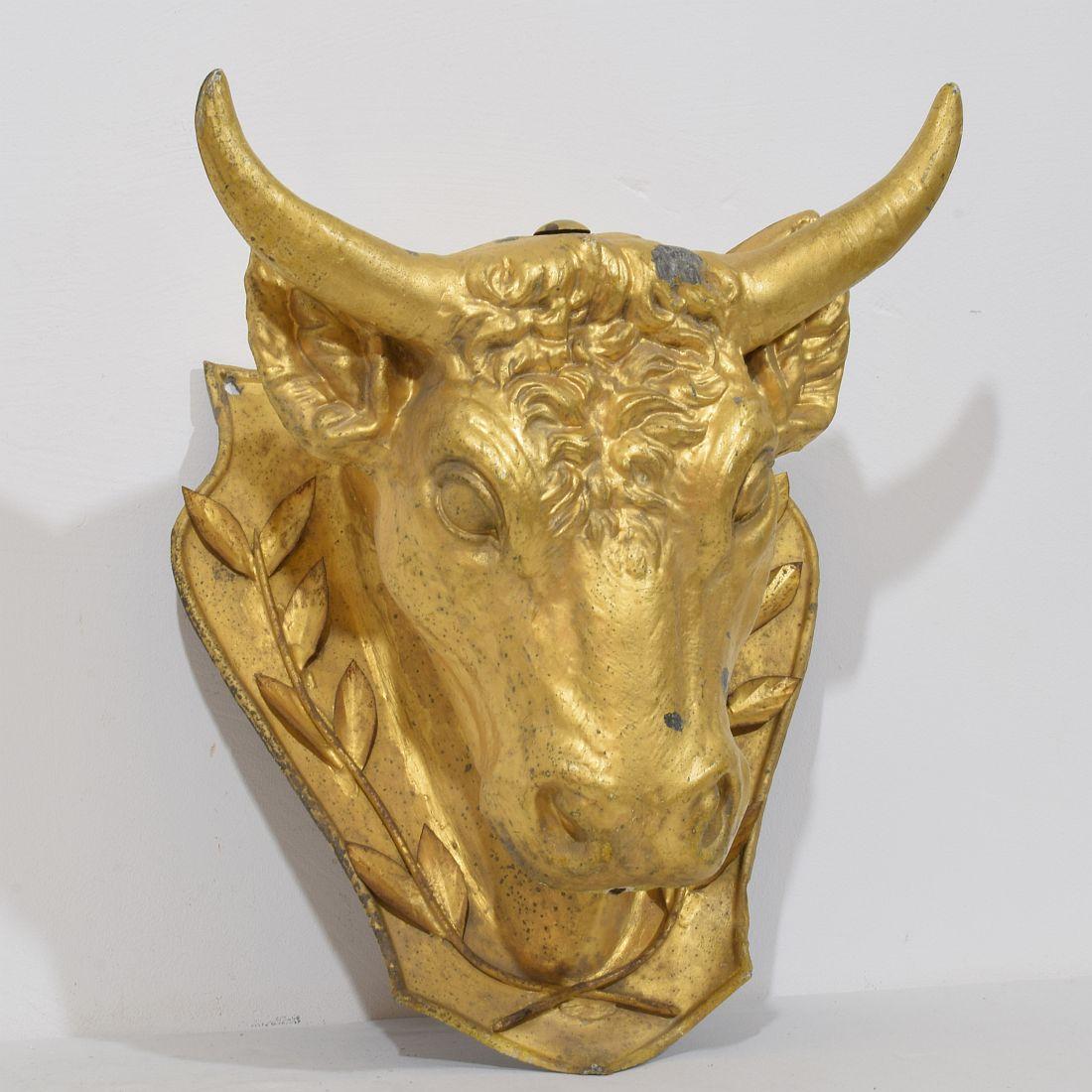 Amazing and extremely rare to find  zinc bull head . This piece was originally used as a trade sign for a butcher shop. It even still has its original gilding. France circa 1850-1900. Weathered and some minor cracks which are not more then normal