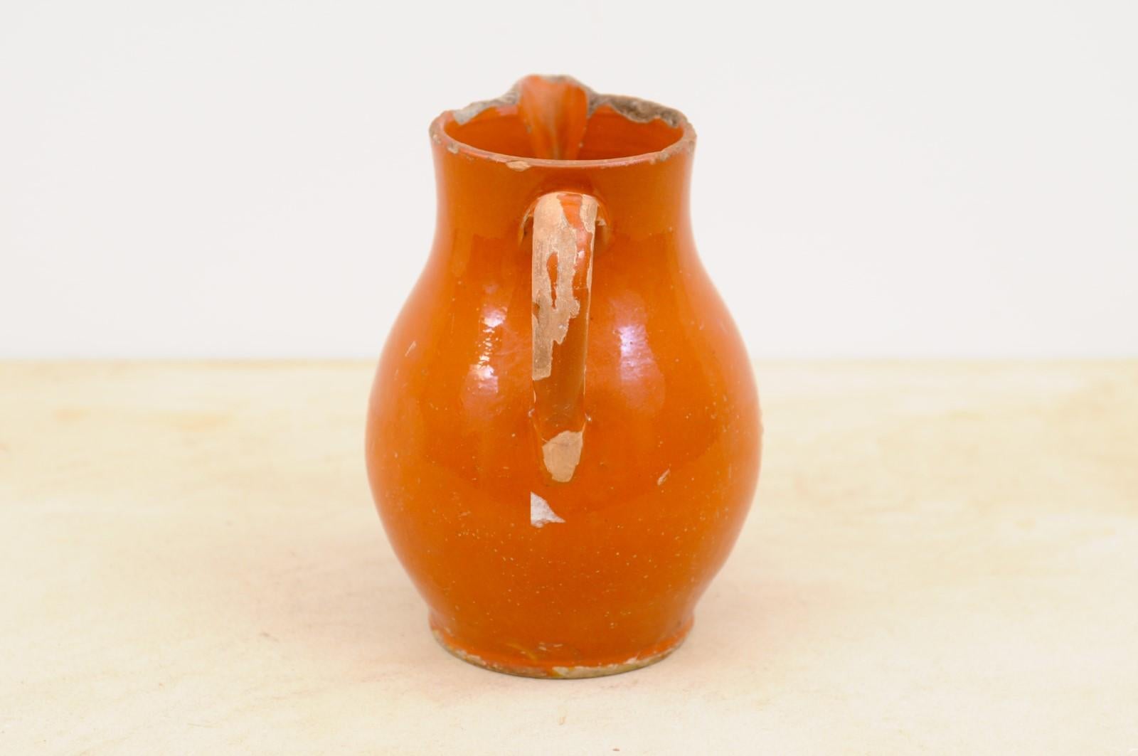 French 19th Century Redware Floral Pitcher with Orange, Cream and Green Glaze In Good Condition For Sale In Atlanta, GA