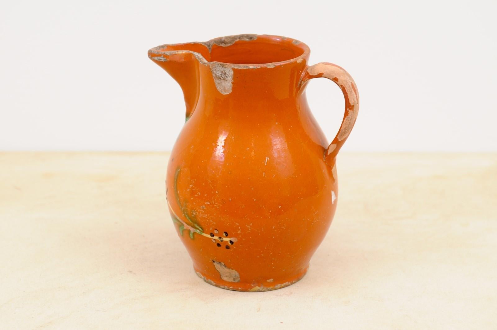 Pottery French 19th Century Redware Floral Pitcher with Orange, Cream and Green Glaze For Sale