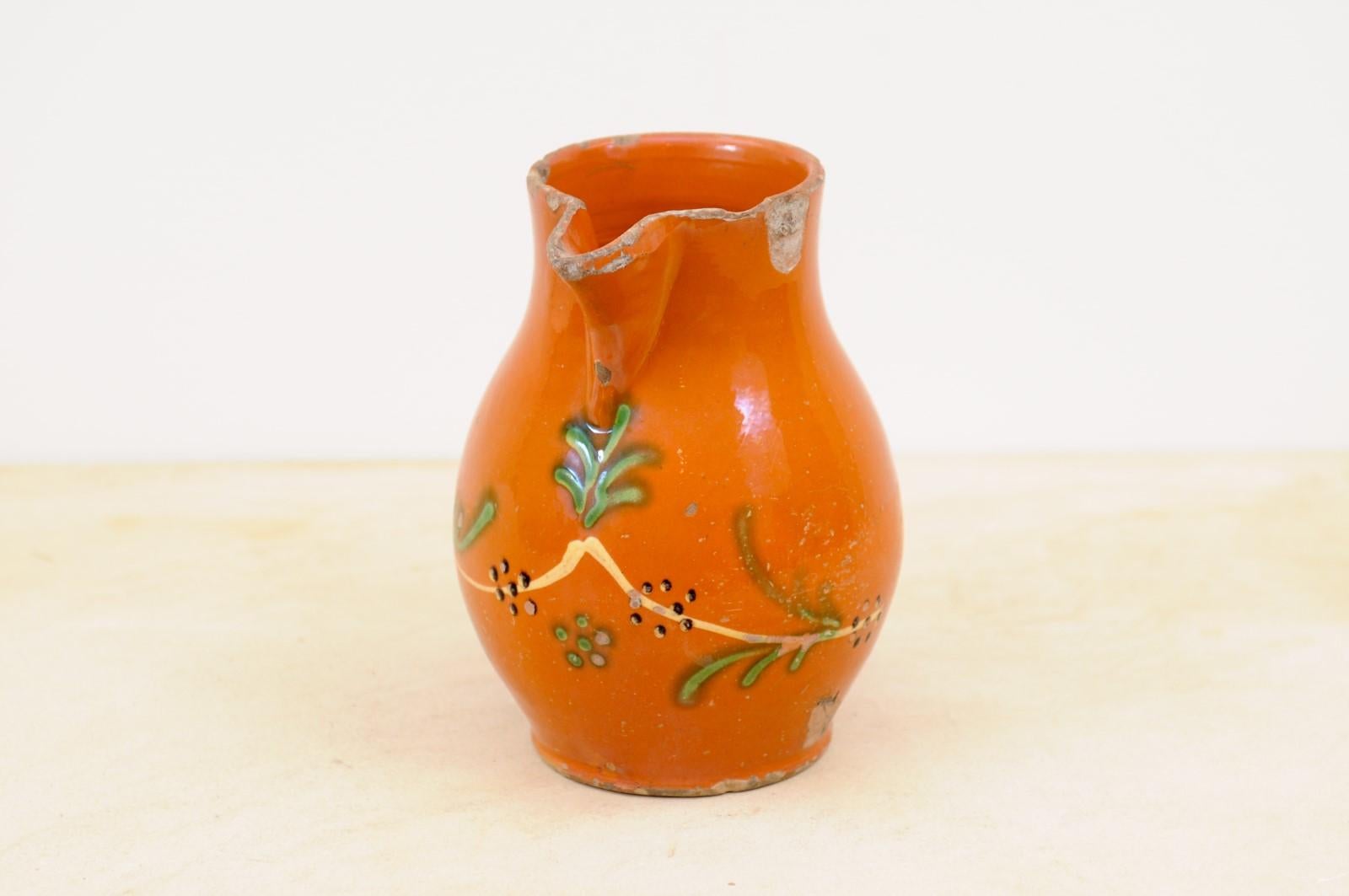 French 19th Century Redware Floral Pitcher with Orange, Cream and Green Glaze For Sale 1