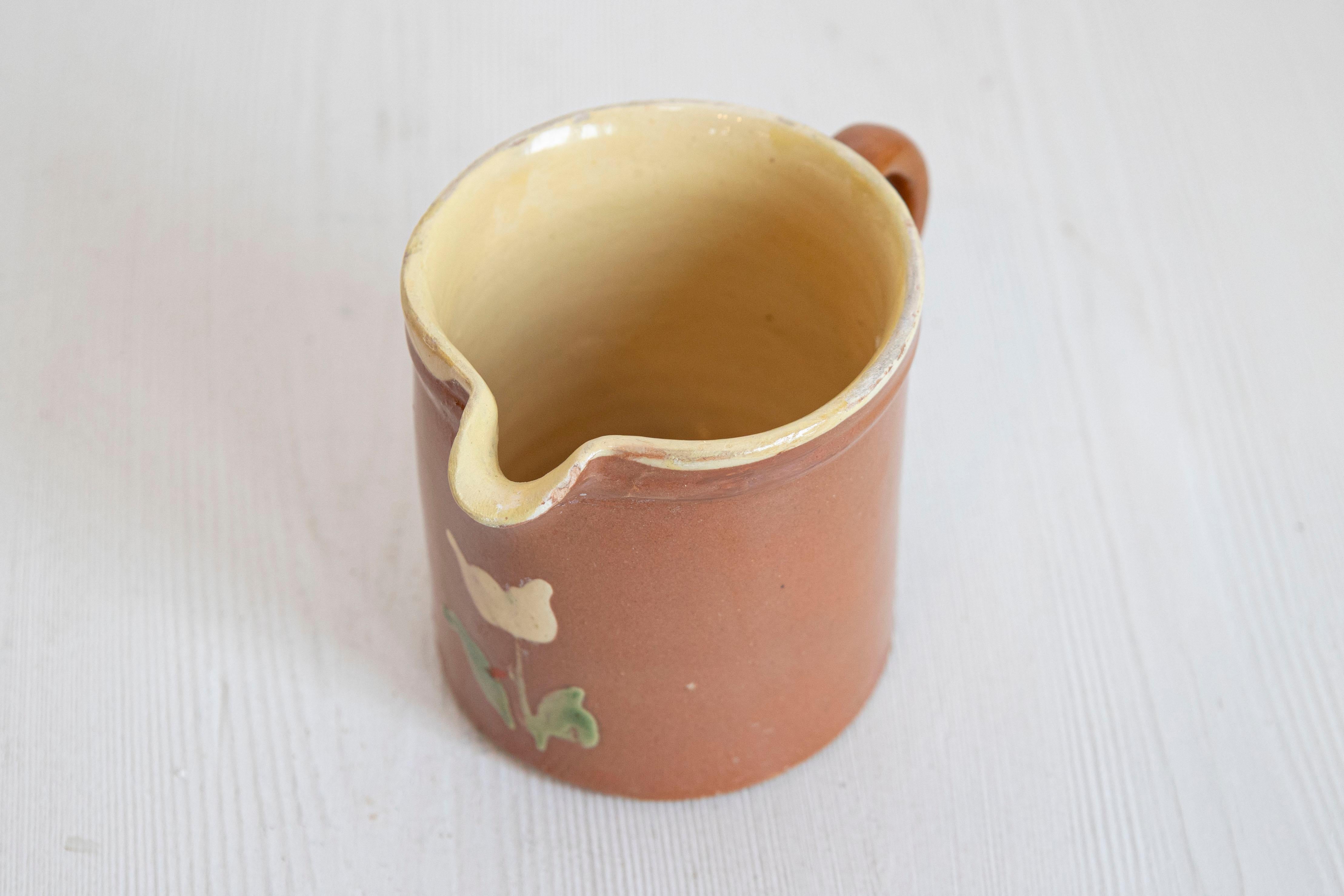 French 19th Century Redware Pitcher with White Flower Decor For Sale 1