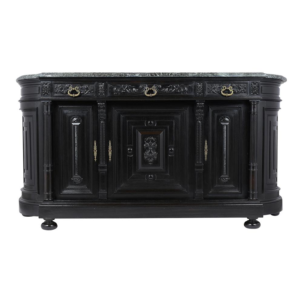 A Late 19th Century French Renassaince Buffet is made out of walnut wood and has a newly ebonized, lacquered, and satin finish. The credenza features its original 1 1/2 inch thick dark green color beveled marble top, curved side design framed with