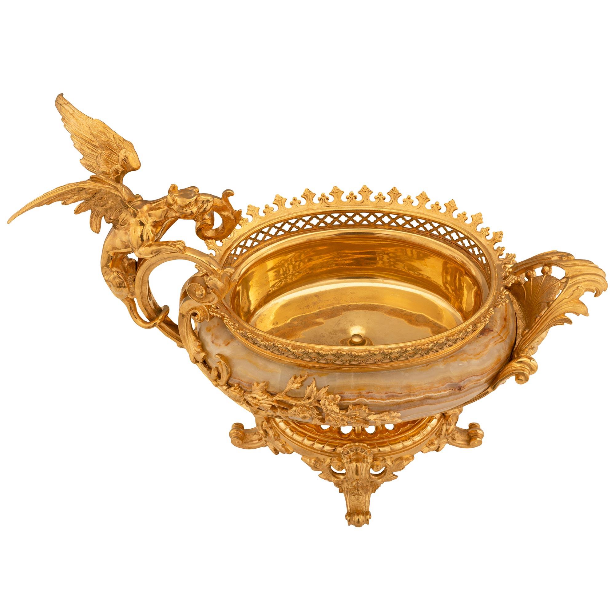 A stunning and most decorative French 19th century Renaissance st. Alabastro marble and ormolu centerpiece/planter. The oblong centerpiece is raised by striking pierced scrolled foliate feet with seashells below the base with a reeded wrap around