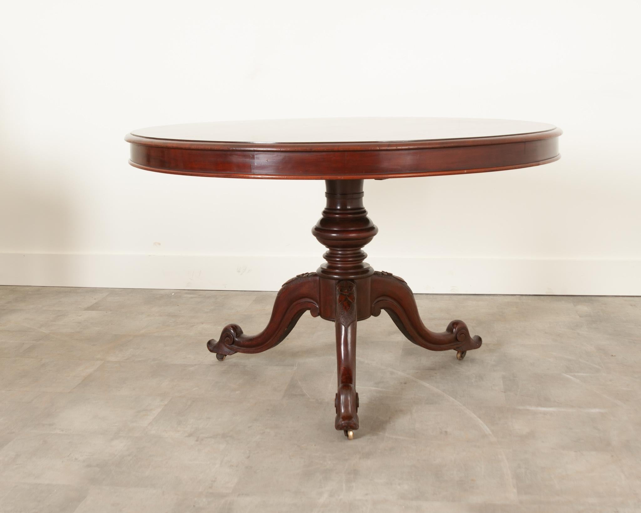 A beautiful mahogany pedestal table from 19th century France. The pedestal base has been carved with wonderful scrolled details. The size of this table makes it ideal for a smaller dining table. The mahogany top can be removed. Have a look at the
