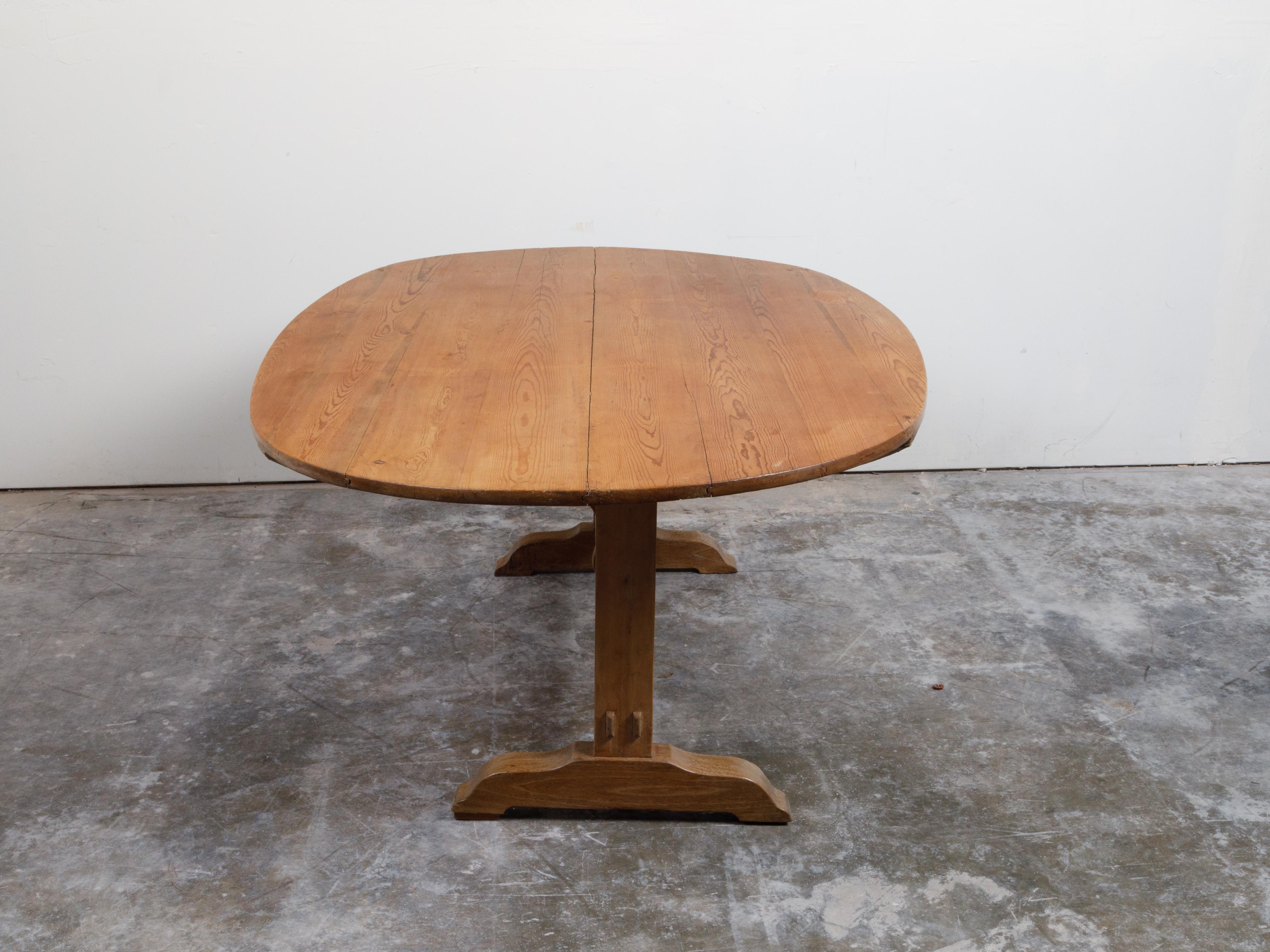 French 19th Century Rustic Walnut Farm Table with Oval Tilt Top and Trestle Base 9