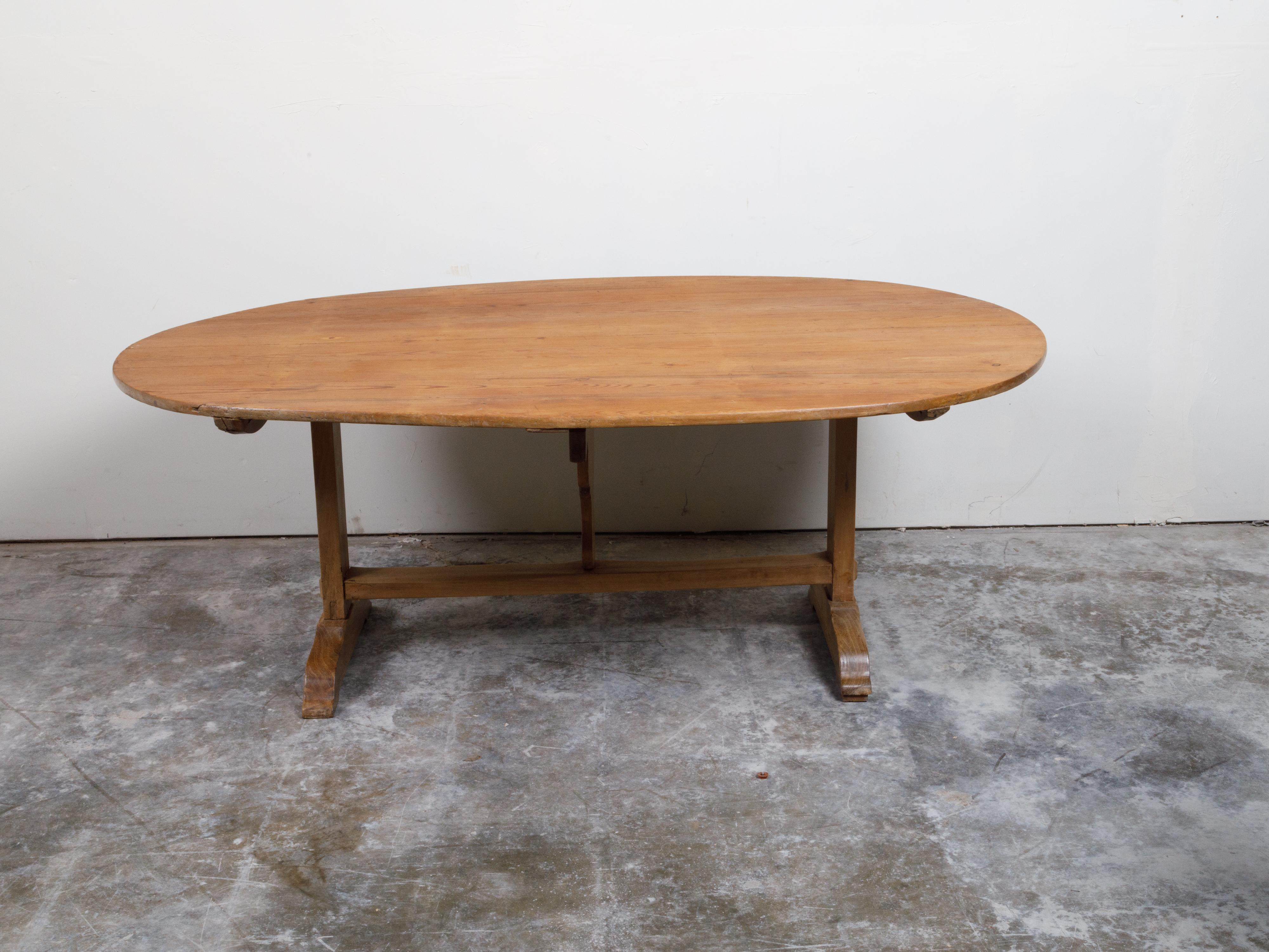 French 19th Century Rustic Walnut Farm Table with Oval Tilt Top and Trestle Base In Good Condition In Atlanta, GA