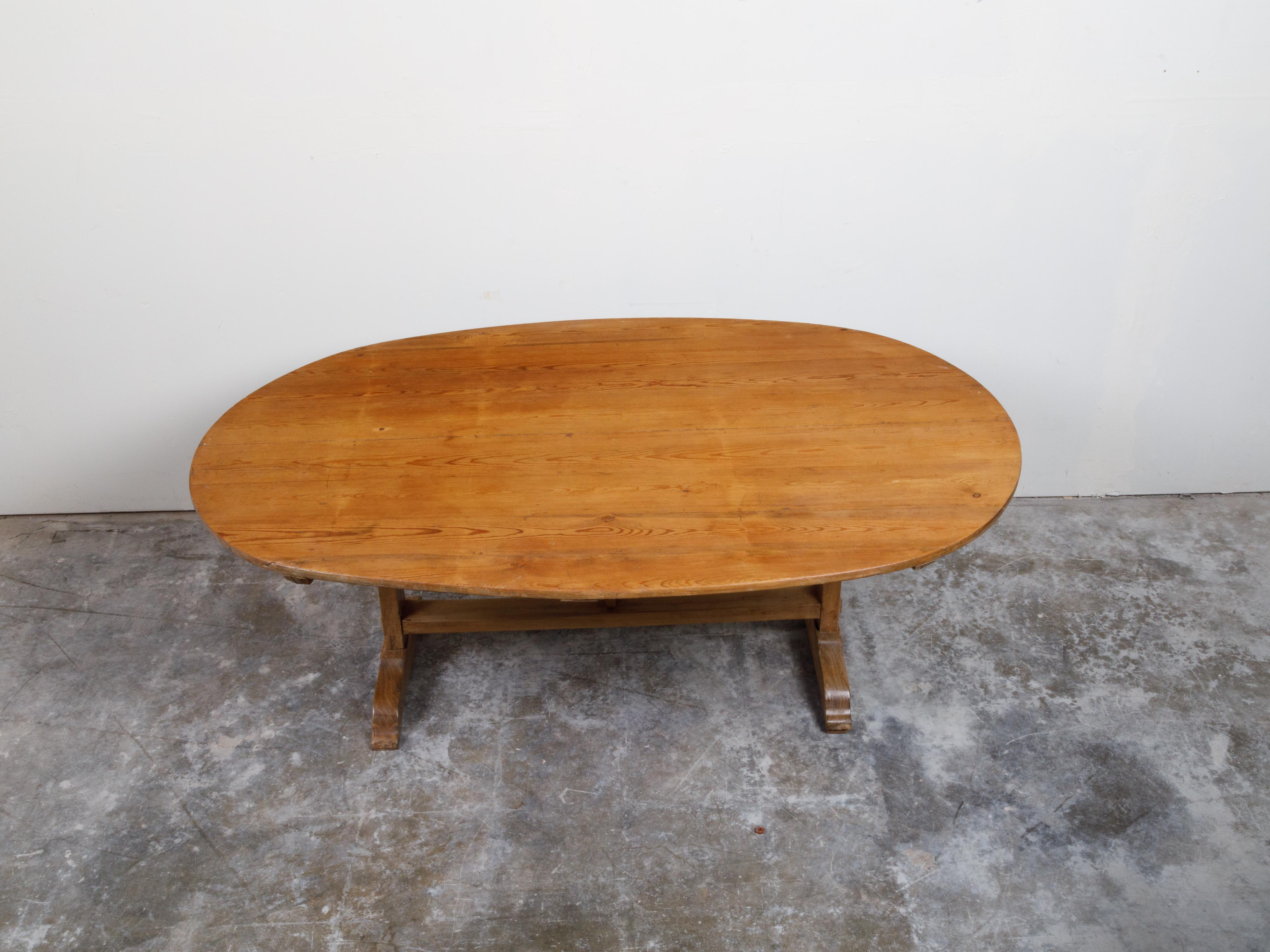 French 19th Century Rustic Walnut Farm Table with Oval Tilt Top and Trestle Base 3