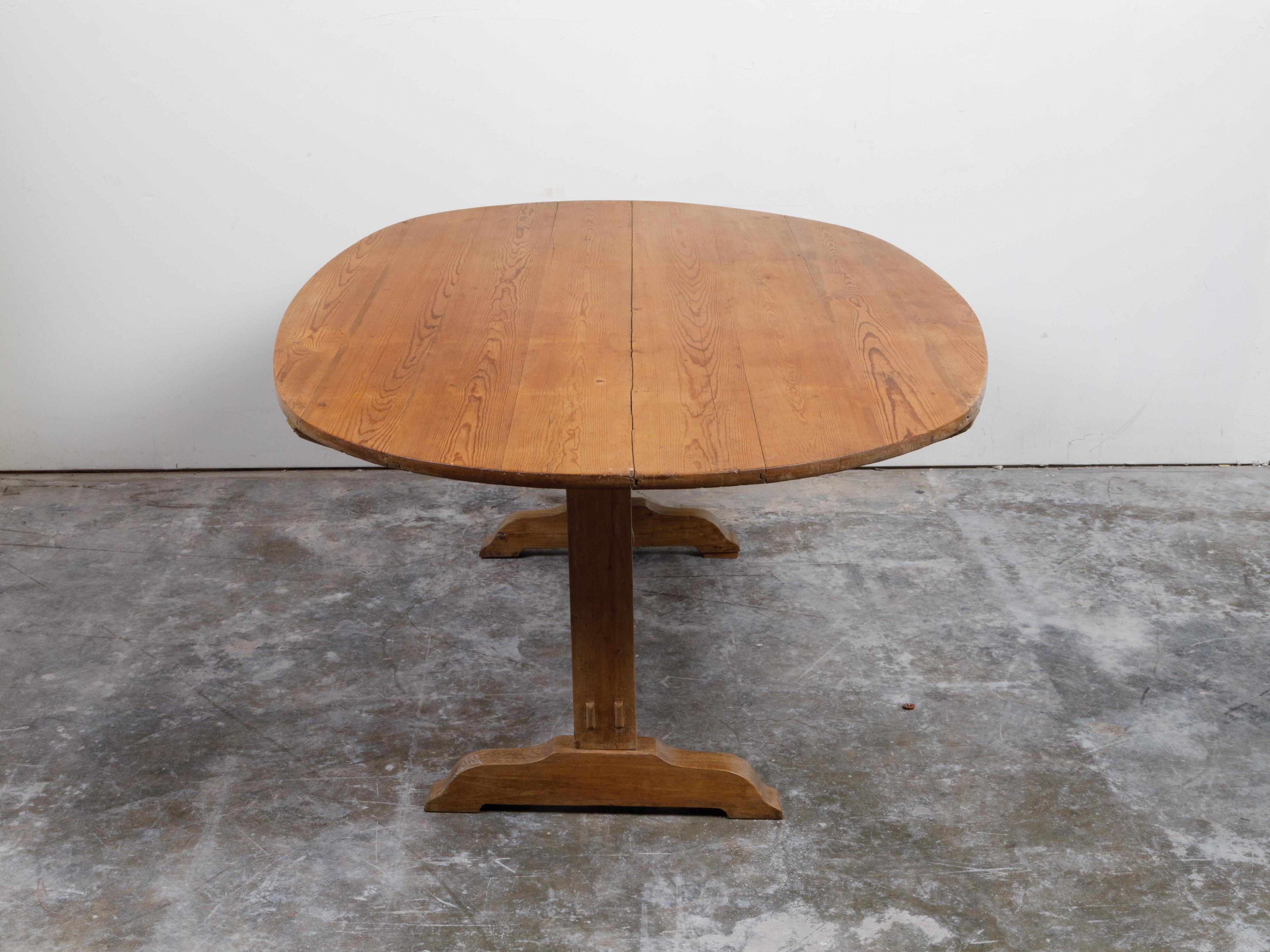 French 19th Century Rustic Walnut Farm Table with Oval Tilt Top and Trestle Base 5