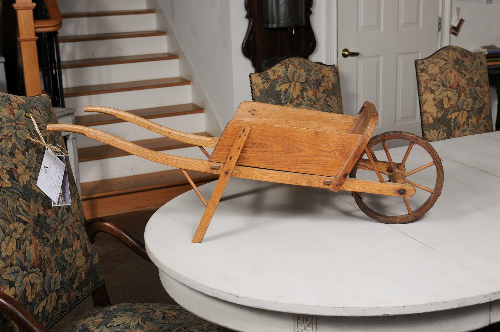 French 19th Century Rustic Wooden Child's Wheelbarrow with Curving Handles In Good Condition In Atlanta, GA