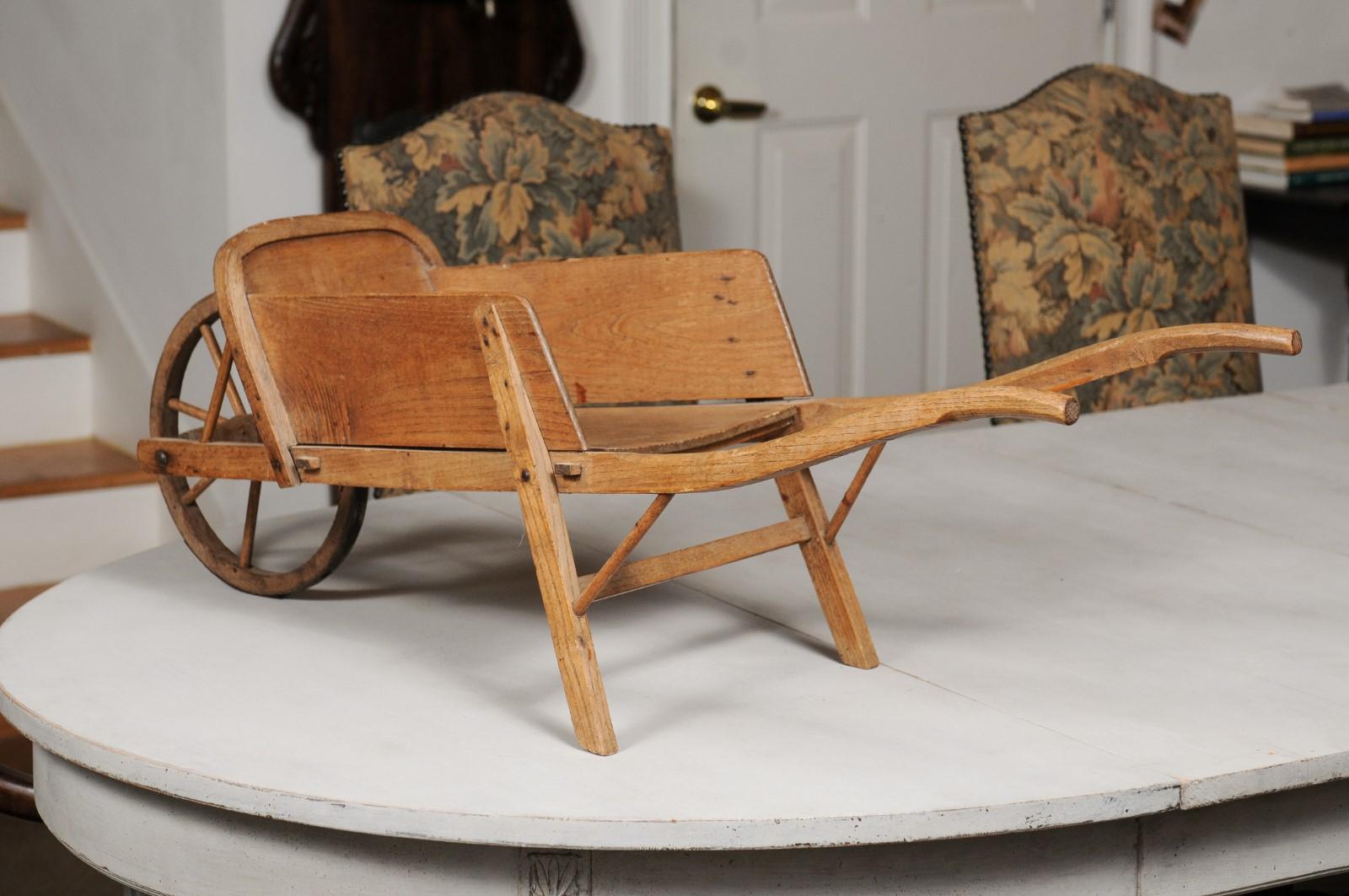 French 19th Century Rustic Wooden Child's Wheelbarrow with Curving Handles 3