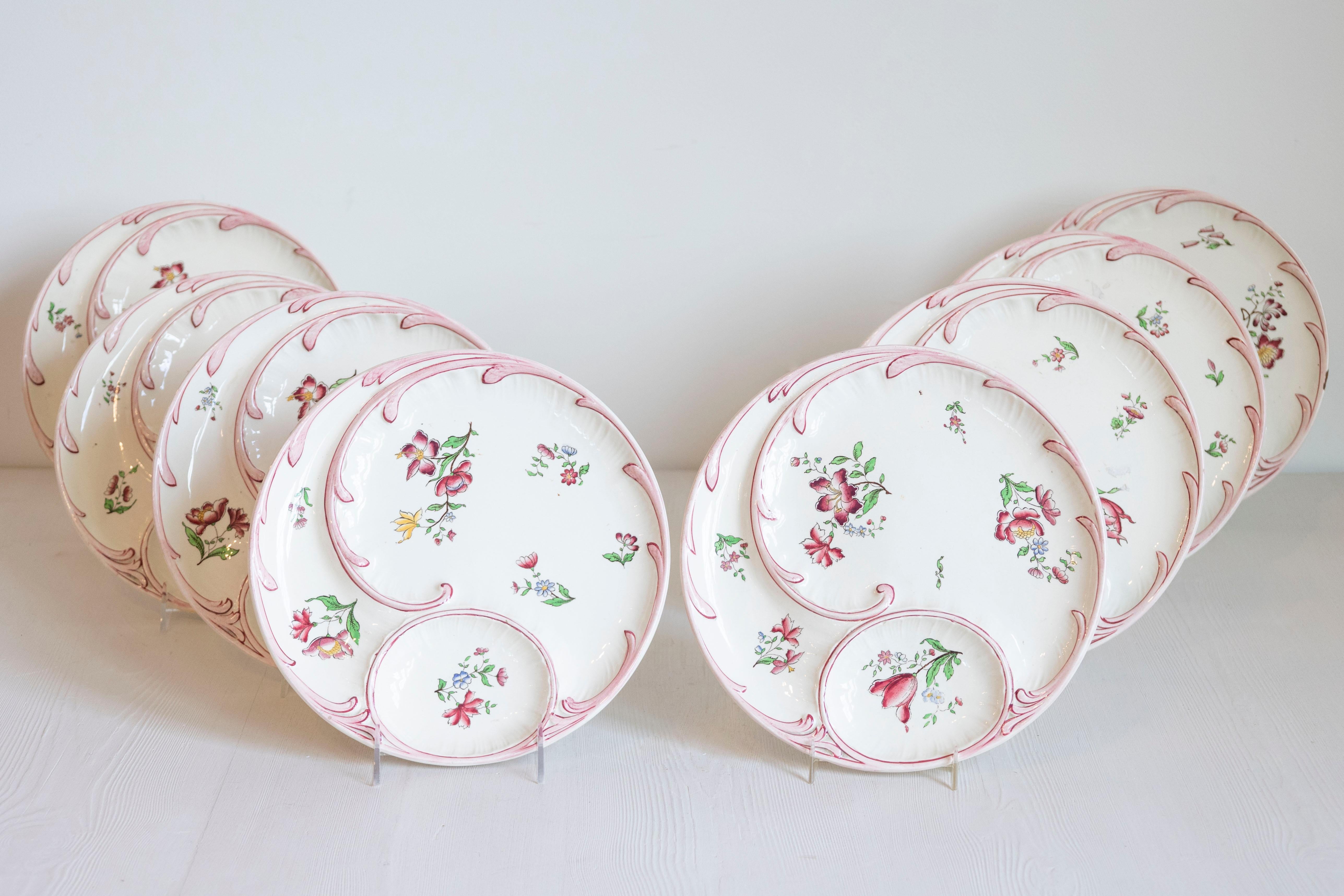 Ten French Sarreguemines Majolica asparagus plates from the 19th century with floral décor, priced and sold individually. Born in France during the 19th century, each of these delicate Sarreguemines asparagus plates features a lovely hand painted