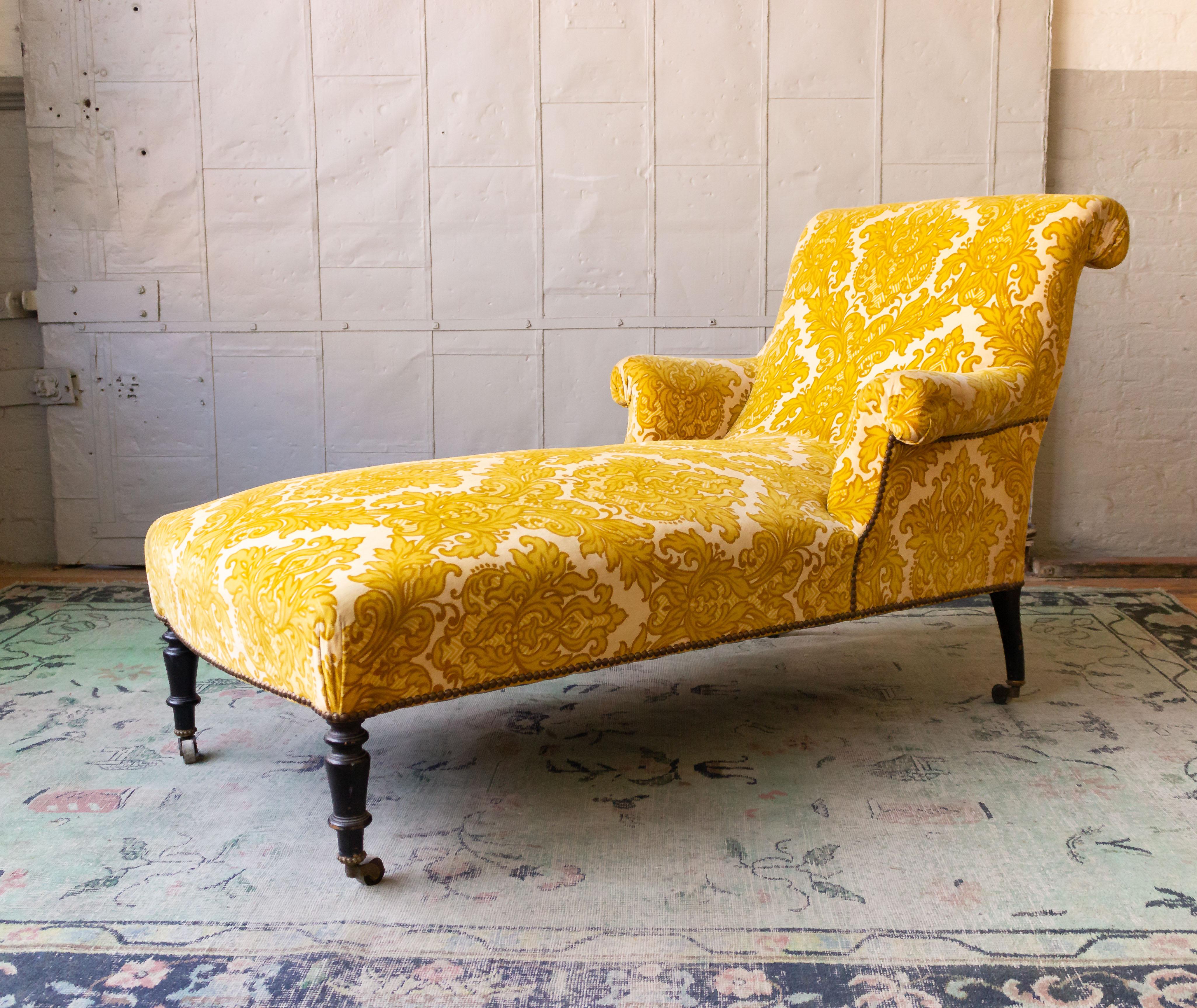 Napoleon III chaise longue upholstered in patterned gold velvet and ebonized legs. French, late 19th century. 

Sold as is, the discounted price is the final net price.