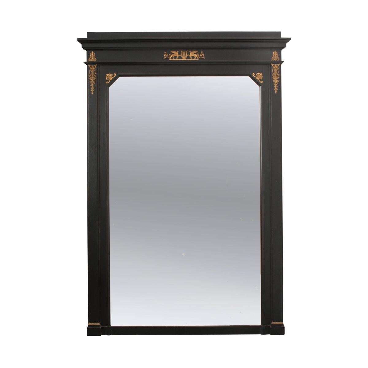 Refine your living space with this smart and sophisticated Empire style console and mirror, done in ebony and brass, from 19th century France. This stately duo will command the attention of all those lucky enough to encounter it. The tall mirror