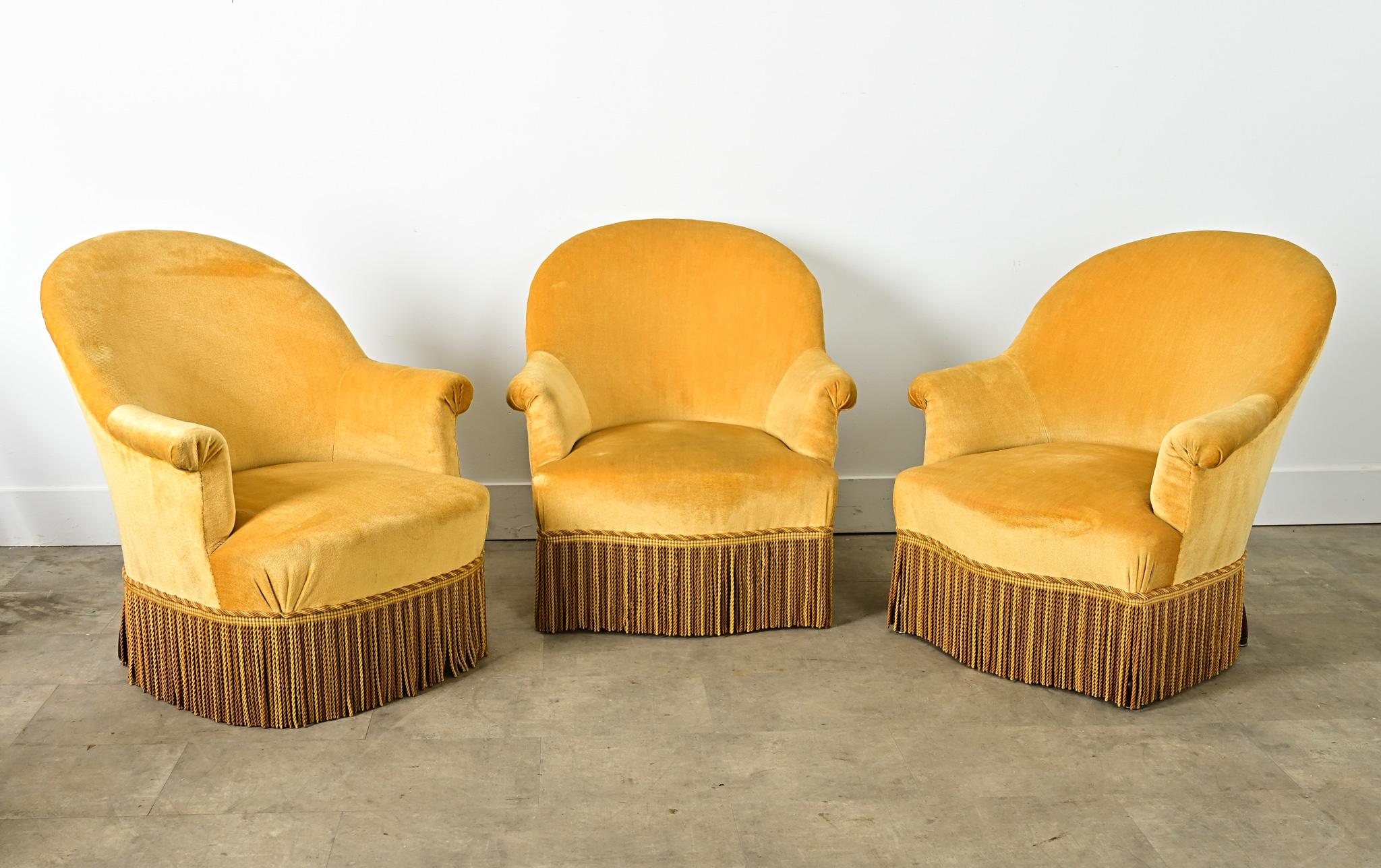 A delightful set of three (3) 19th century French “fauteuil crapaud”, these Empire style chairs are affectionately named after their resemblance to a toad but in the current gold velvet upholstery the look is far more glamorous than amphibious.